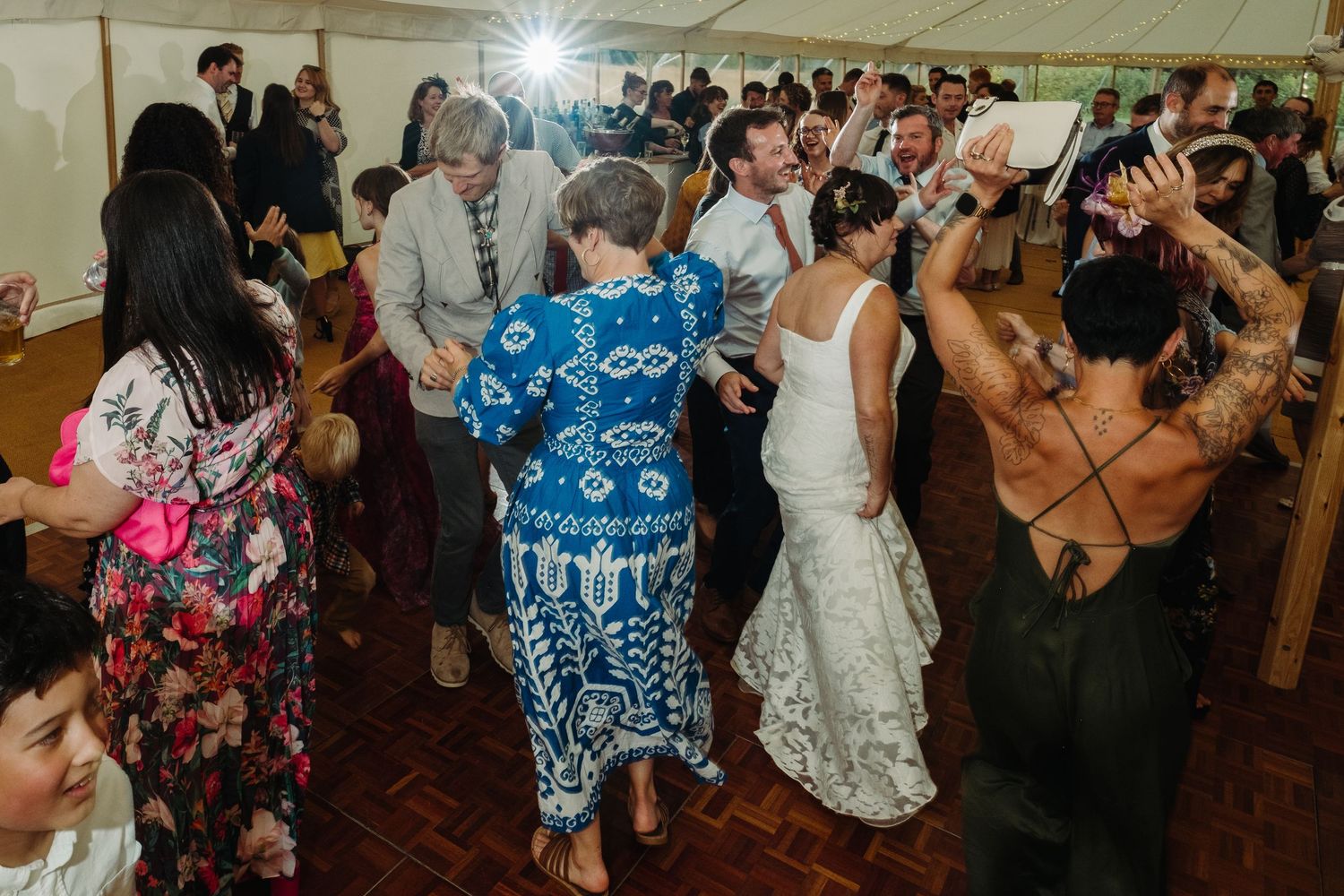 Wedding reception dancing by Norfolk wedding photographer covering Norfolk, Norwich, Suffolk, Cambridgeshire and throughout the UK.d.