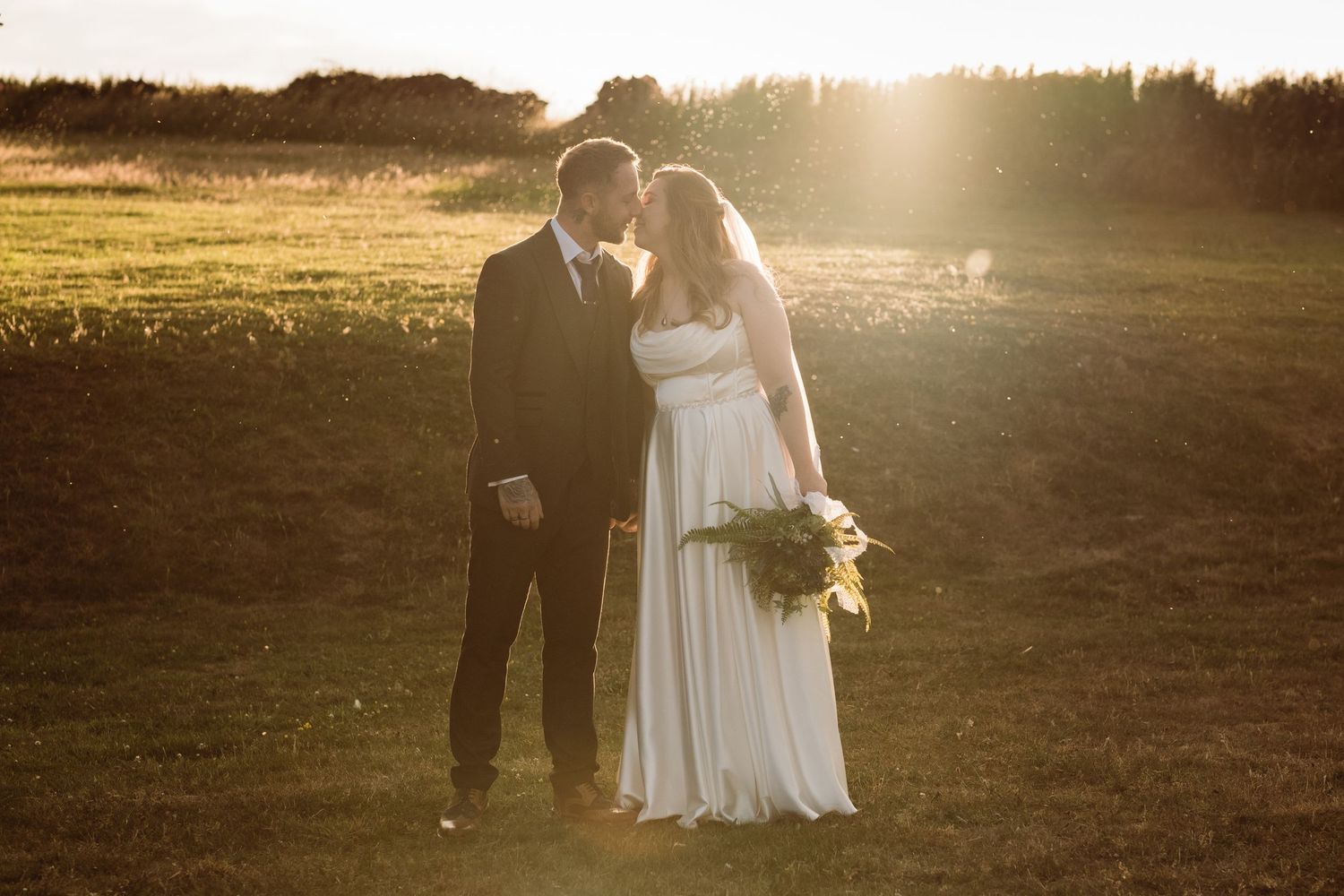 A beautiful sunset wedding by Norfolk and Norwich wedding photographer. Top 100 wedding photographer covering Norfolk, Suffolk, Cambridge.