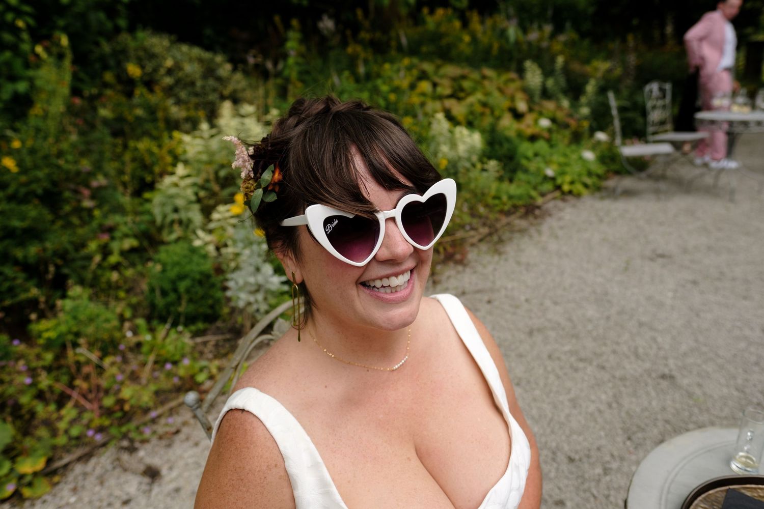 Wedding guests in summer attire enjoying a casual outdoor reception. Norfolk and Norwich wedding photographer.