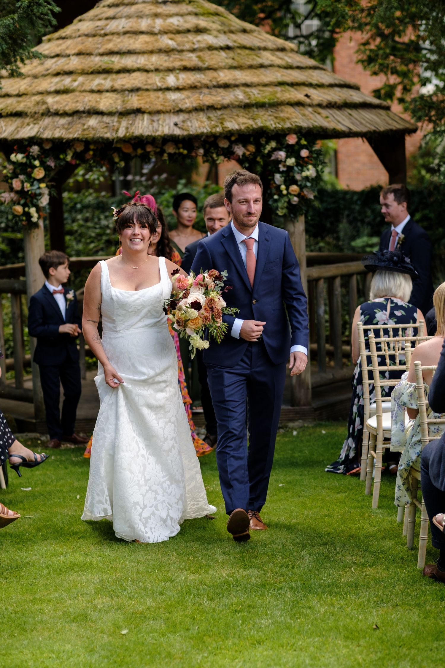 Outdoor wedding ceremony by Norfolk and Norwich wedding photographer covering Norfolk, Suffolk, Cambridgeshire, and throughout the UK.