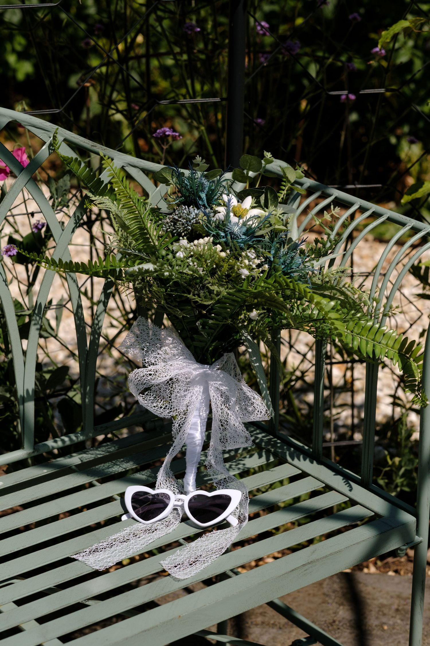 Bouquet and sunglasses by Norfolk and Norwich wedding photographer. Top 100 wedding photographer covering Norfolk, Suffolk, Cambridge.