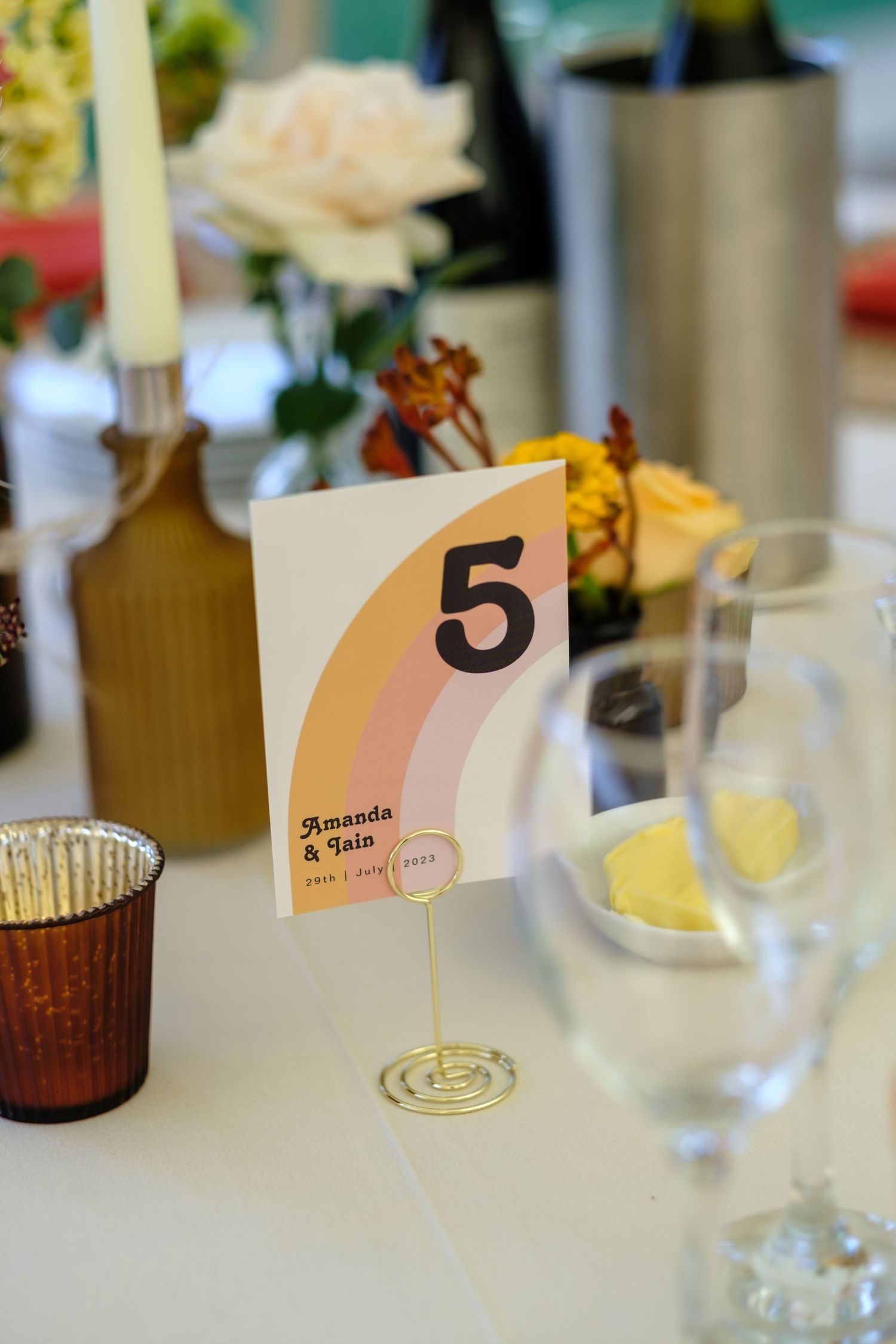 Wedding reception table numbers and place cards with floral decorations. Norfolk and Norwich wedding photographer.