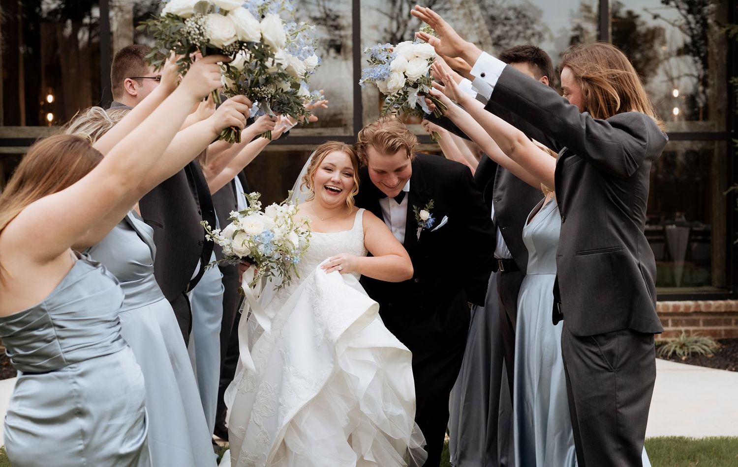 Wedding party photo tunneling bride and groom 1684 Venue- Oklahoma Wedding