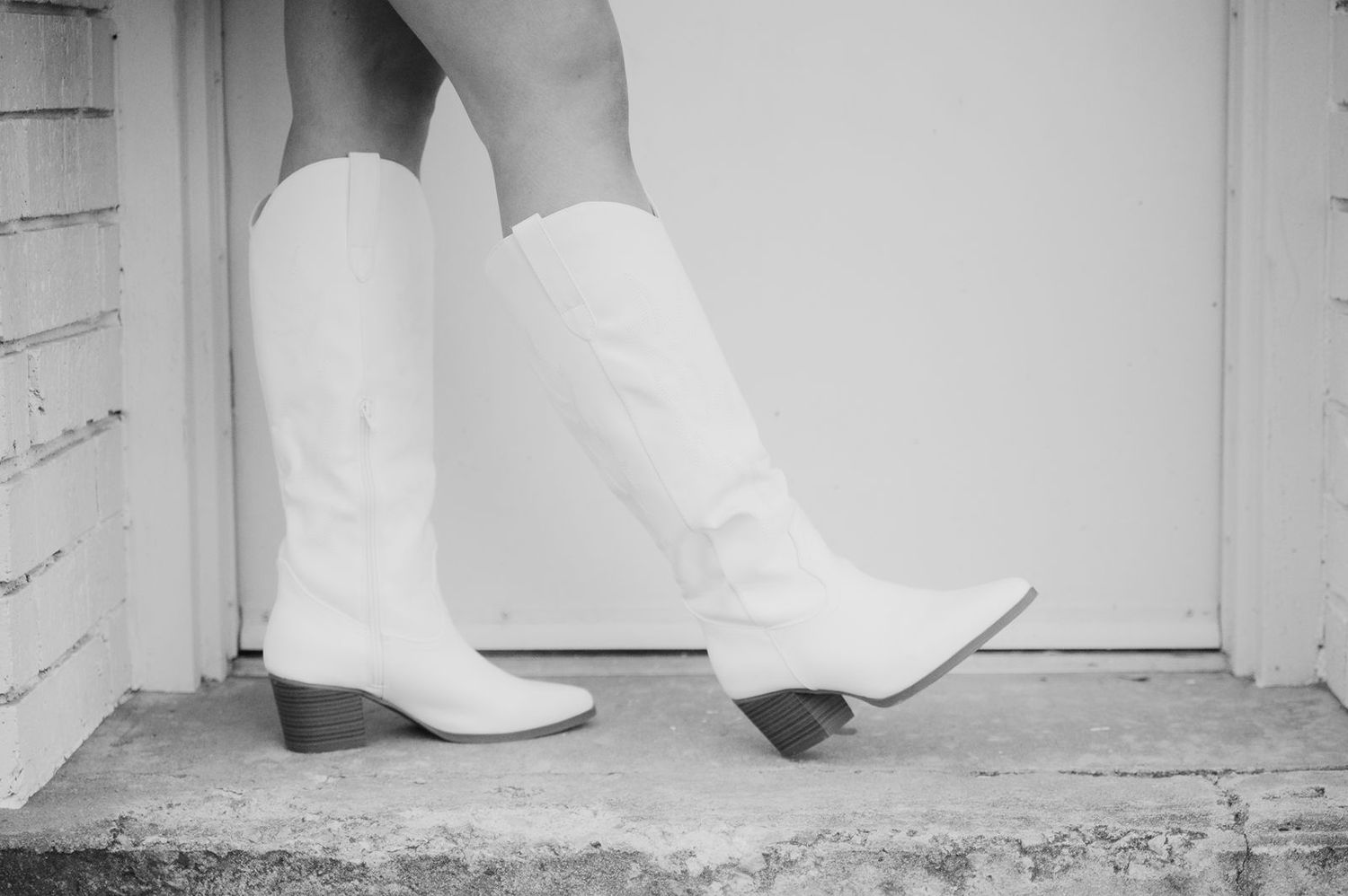 picture of white boots in doorway