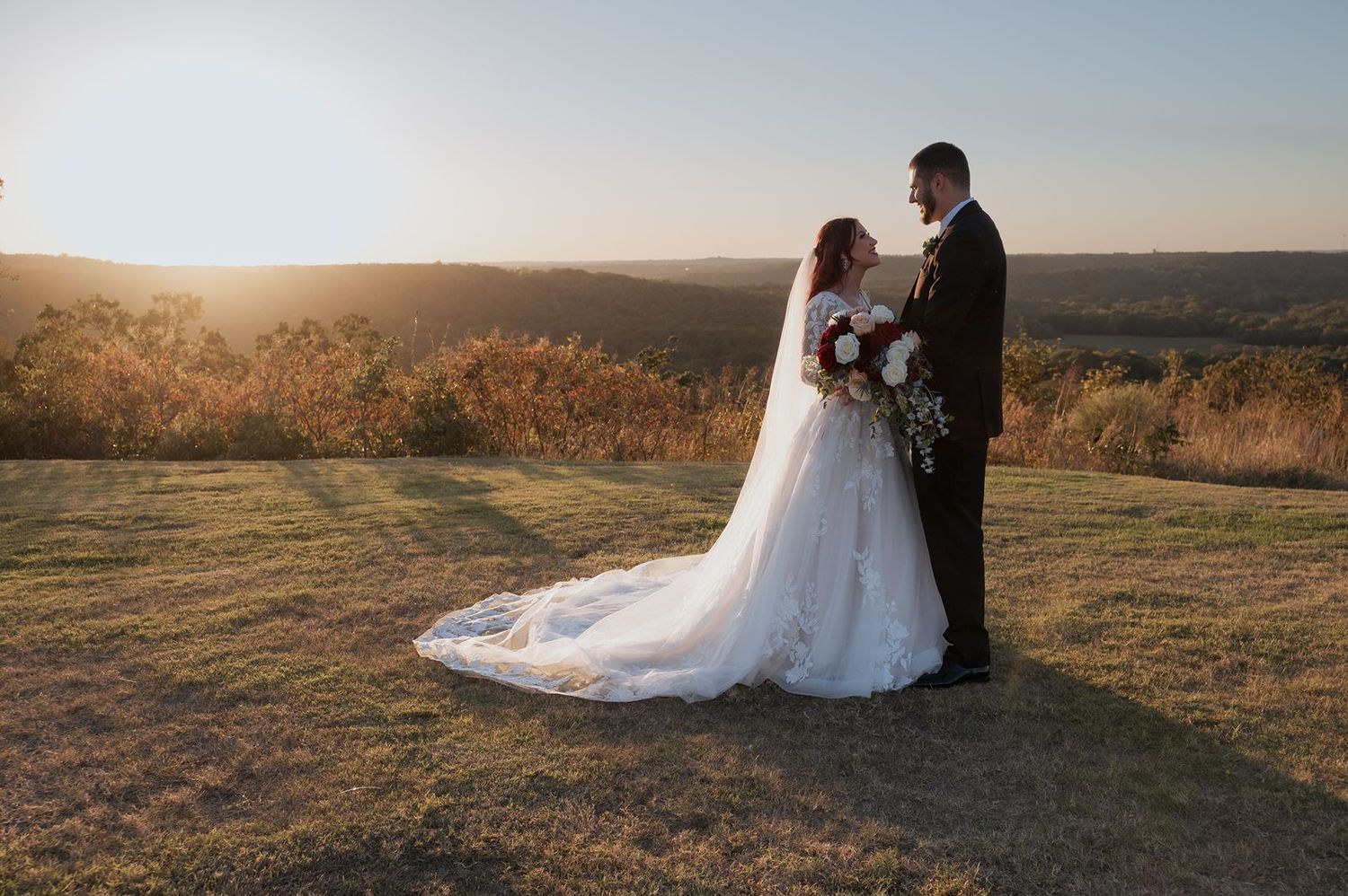 Bride and Groom portrait over rolling hills in Oklahoma