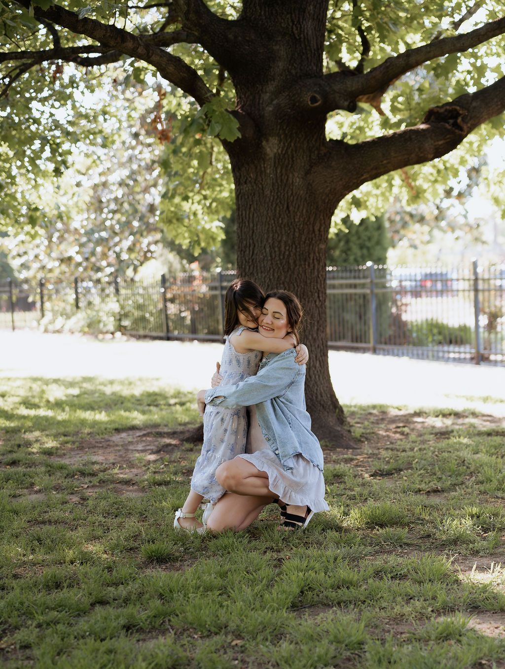 Tulsa motherhood photographer capturing a sweet  hug during a spring mini session