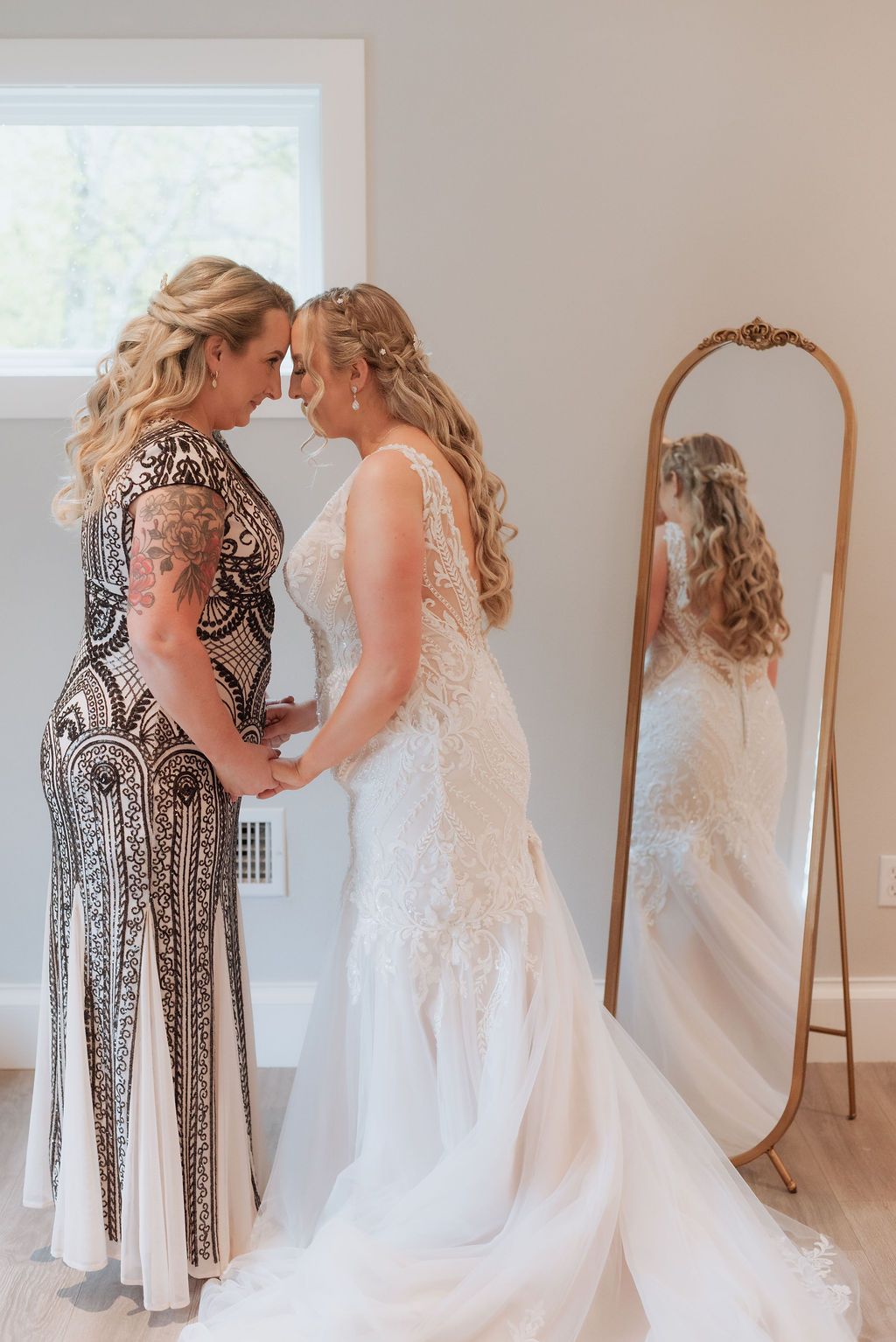 Mother and daughter before the ceremony, sharing a special moment