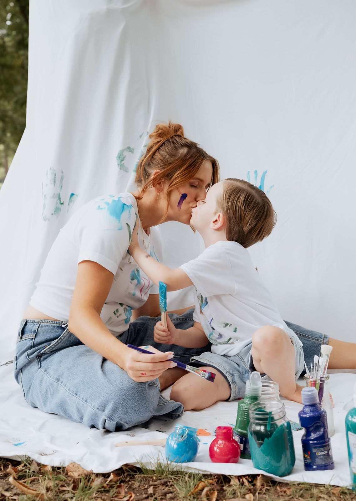 Son showing affection to his momma in a unique photography session