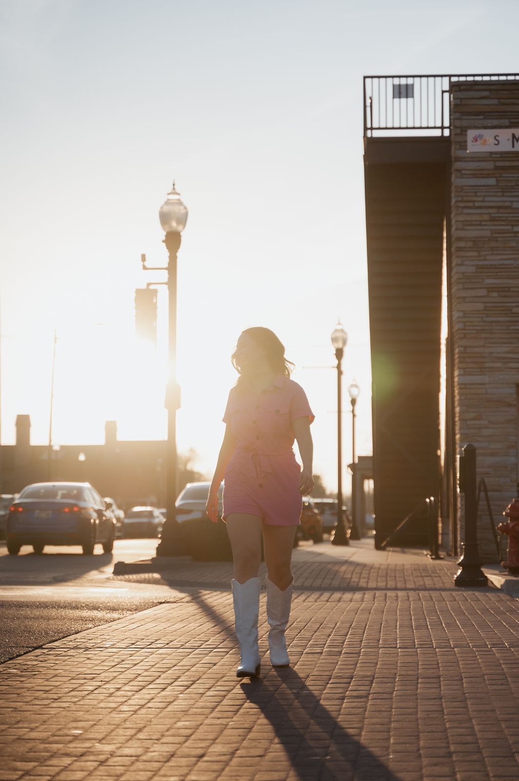 girl walking across Main Street in Broken Arrow