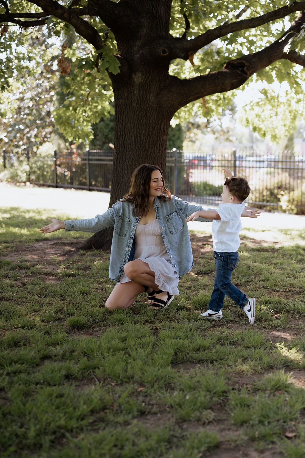 Tulsa motherhood photographer capturing a sweet  embrace during a spring mom and kids session