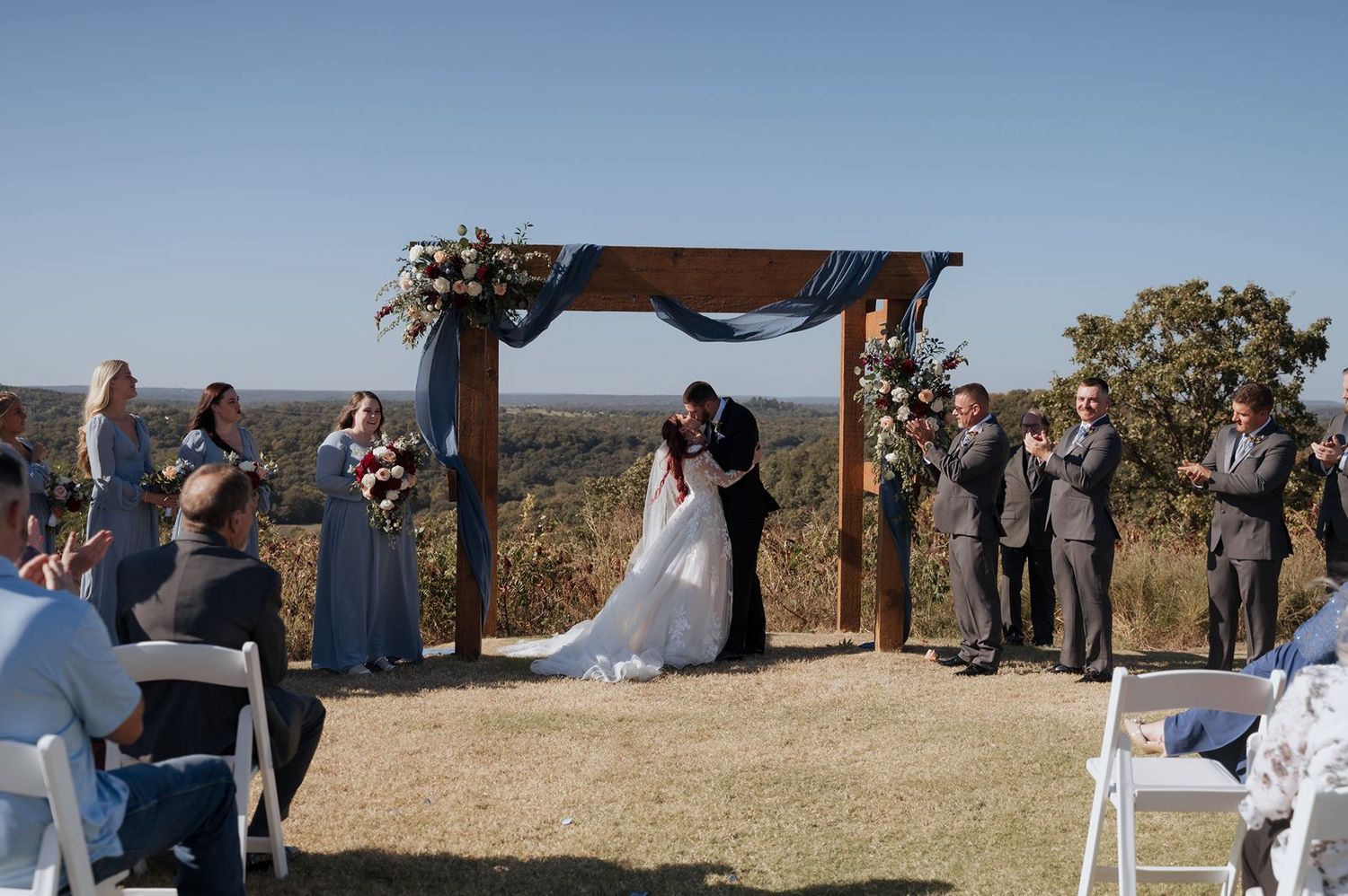 Bride and groom first kiss at The View at Hillside Barn