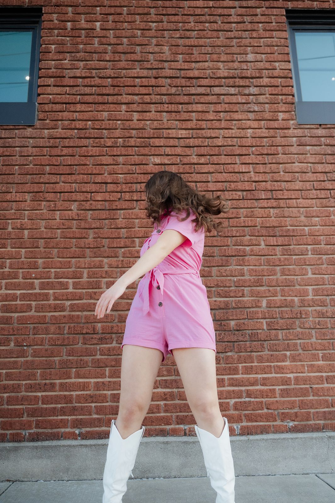 Girl doing editorial style posing in Broken Arrow Rose District