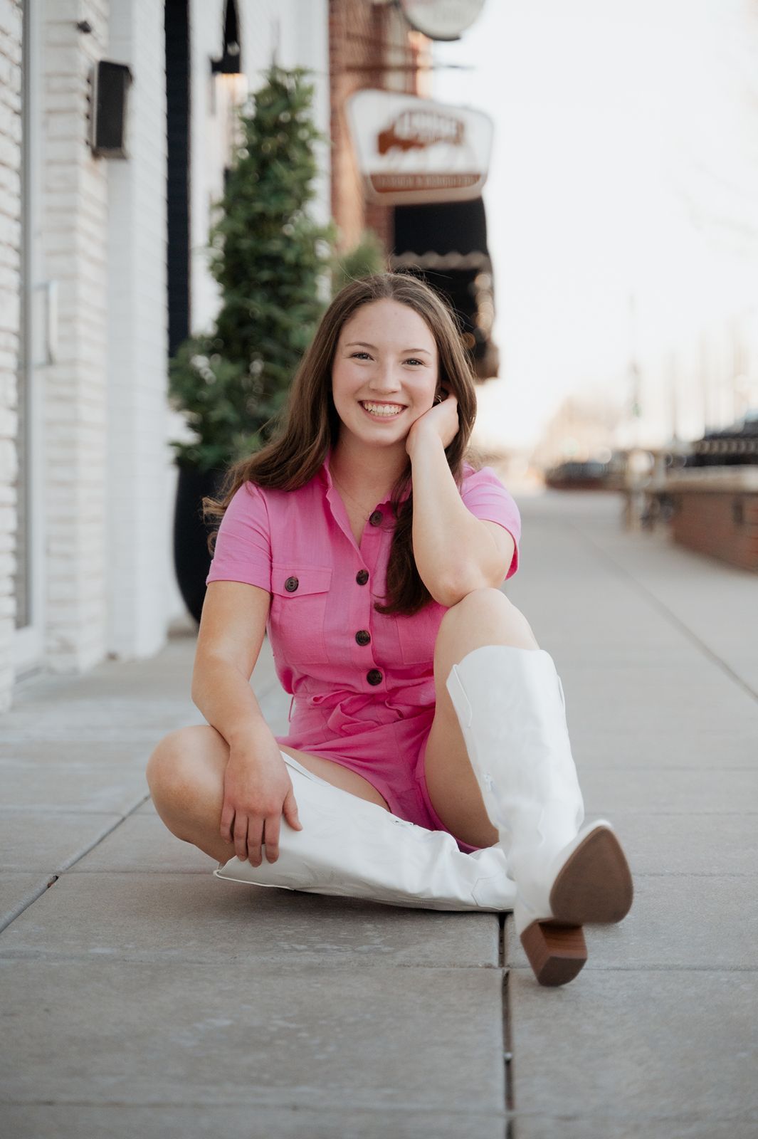 Model smiling on the sidewalk in Broken Arrow