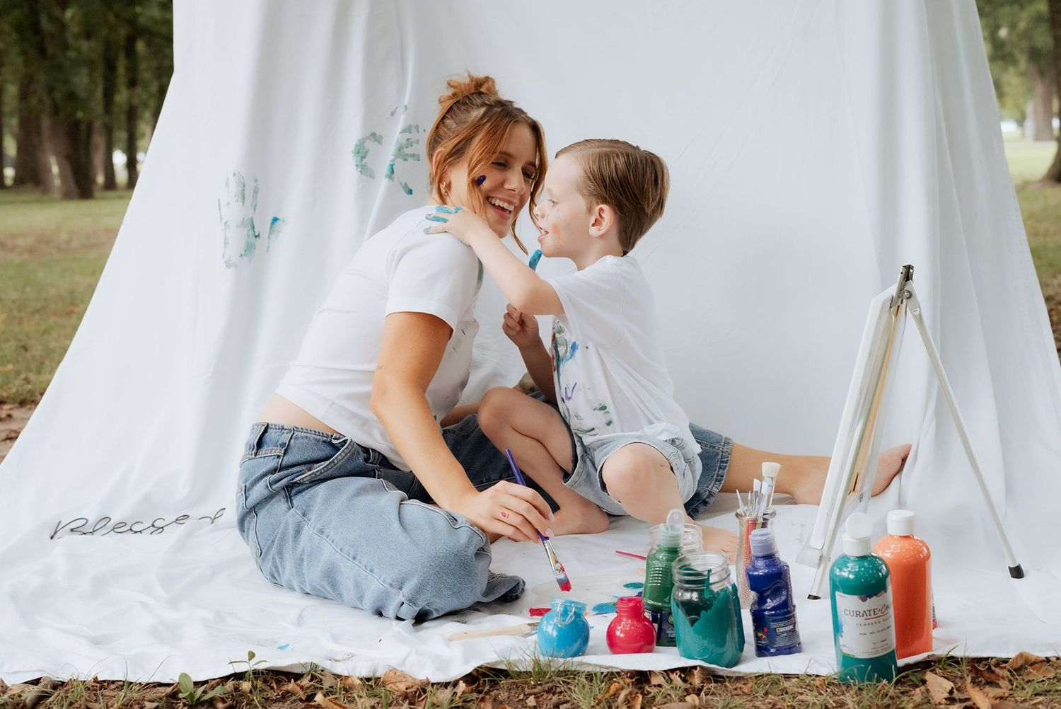 Son and mom doing a paint photo shoot at Haikey Creek Park in Tulsa