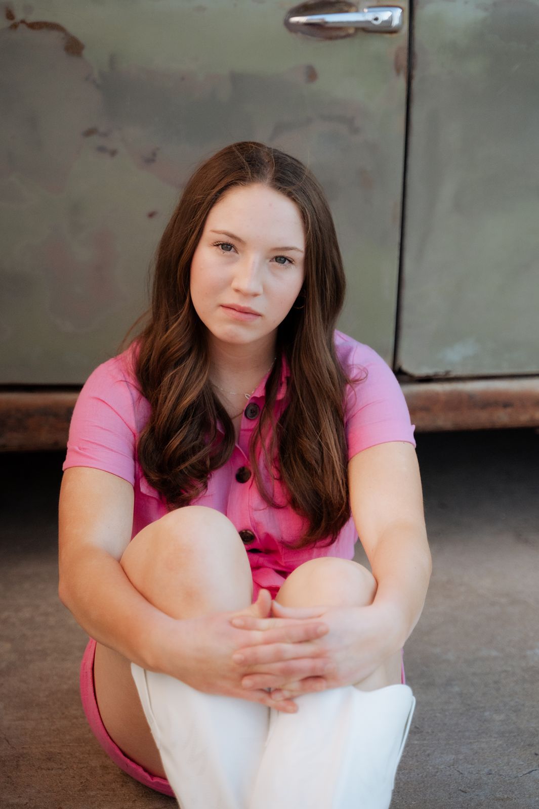 serious pose with a young girl by old rusty car
