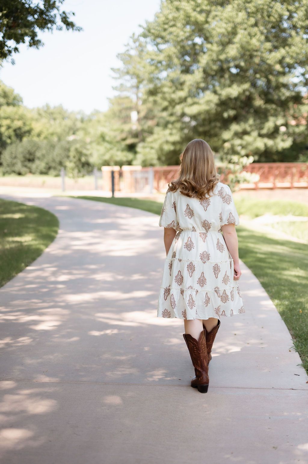 Girl walking through Philbrook Gardens pathway in Tulsa