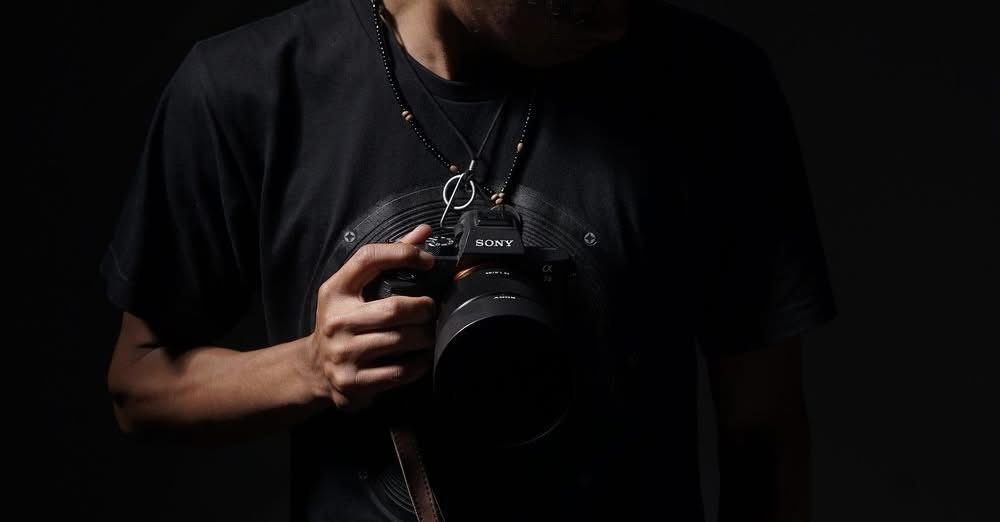Veteran-owned Lehigh Valley headshot photographer behind the camera at The Confident Lens studio, helping clients feel comfortable and confi