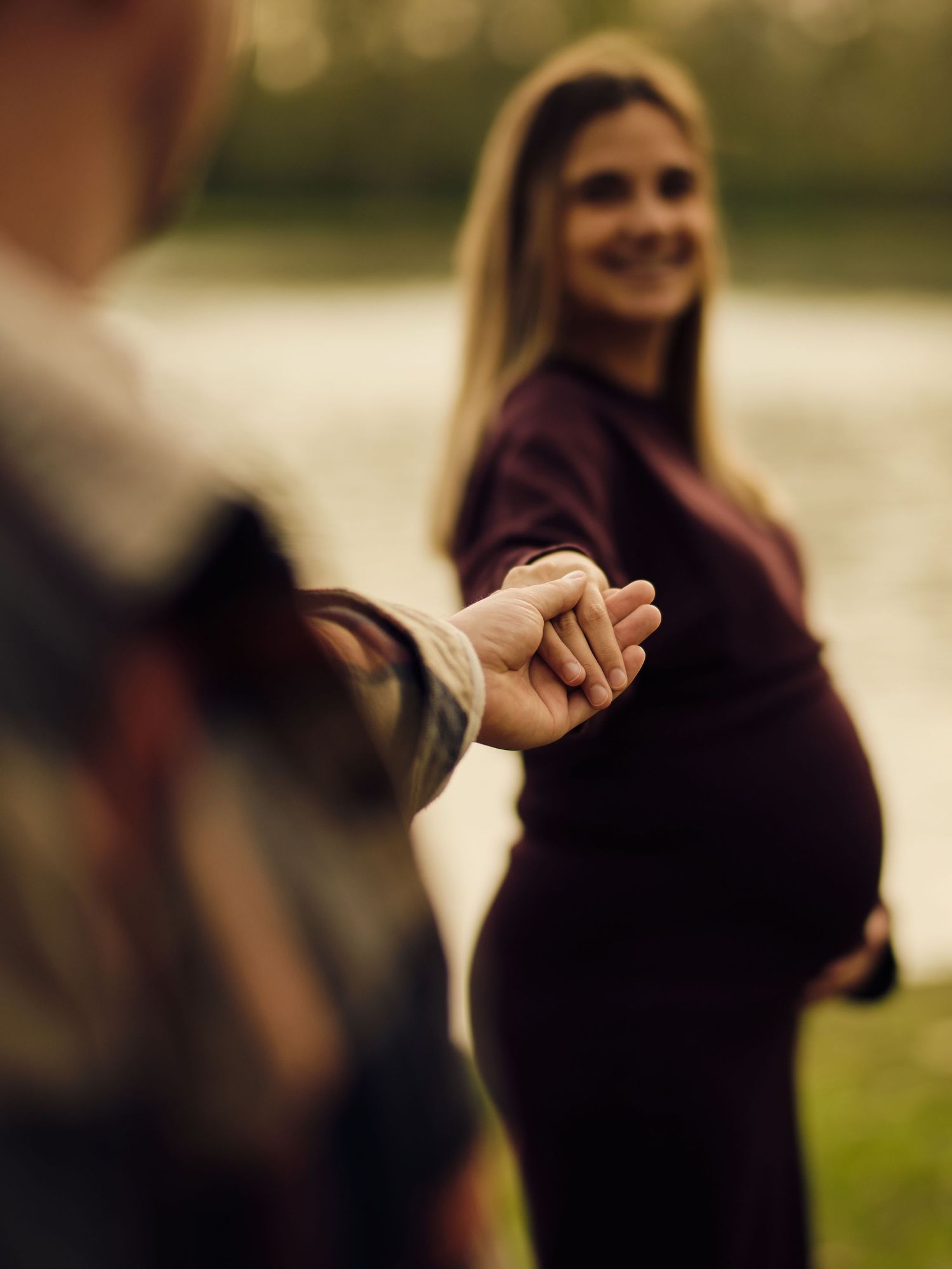 A series of blurred photos showing a person in a purple sweater making various gestures outdoors.
