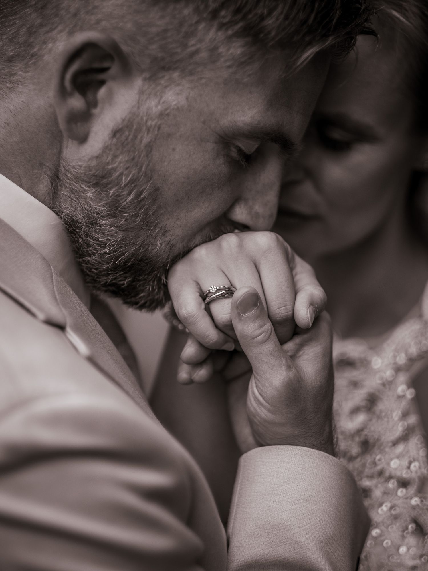Intimate black and white close-up sequence capturing tender romantic moments.
