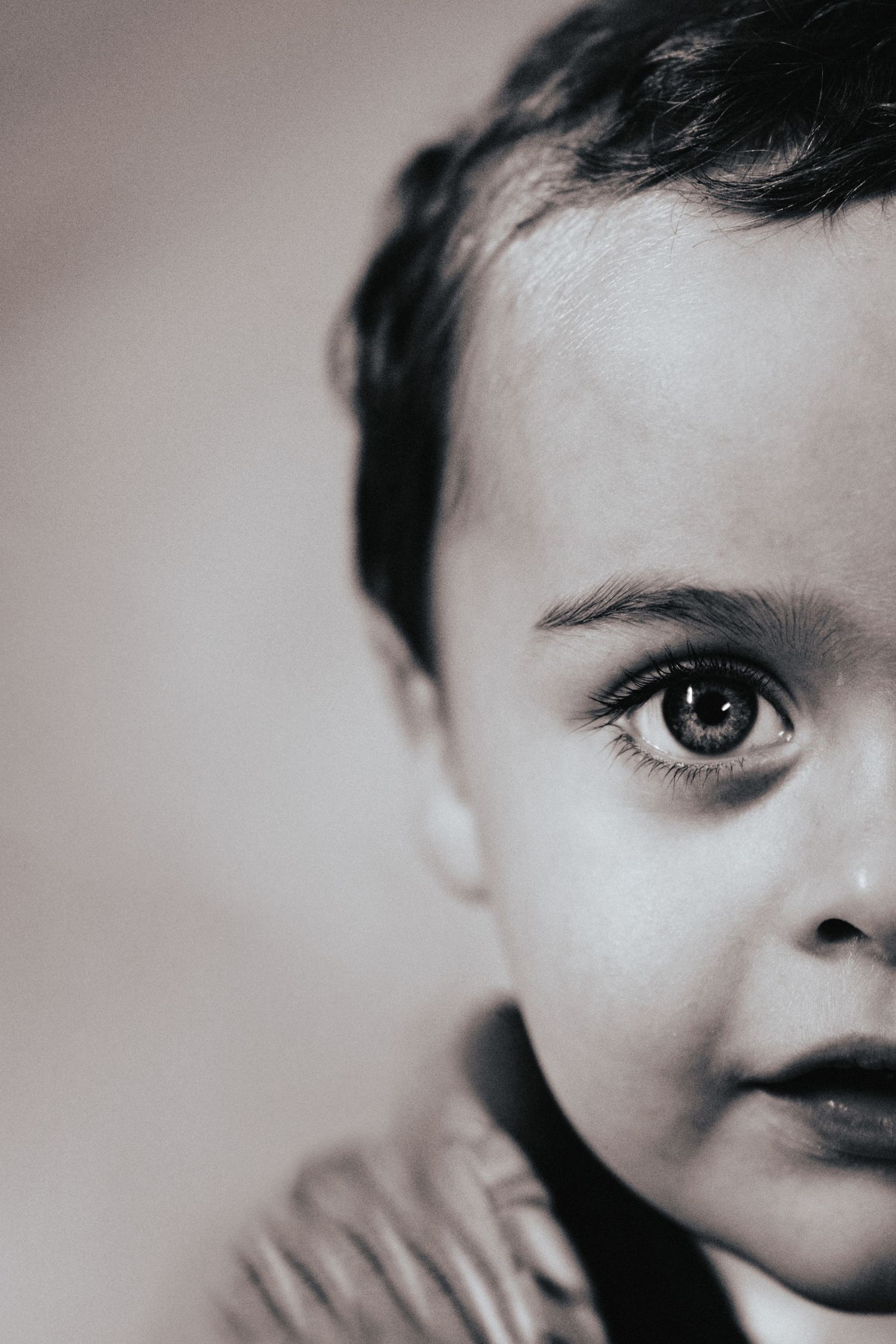 A close-up series of cropped facial features showing eyes and partial faces in black and white photography.