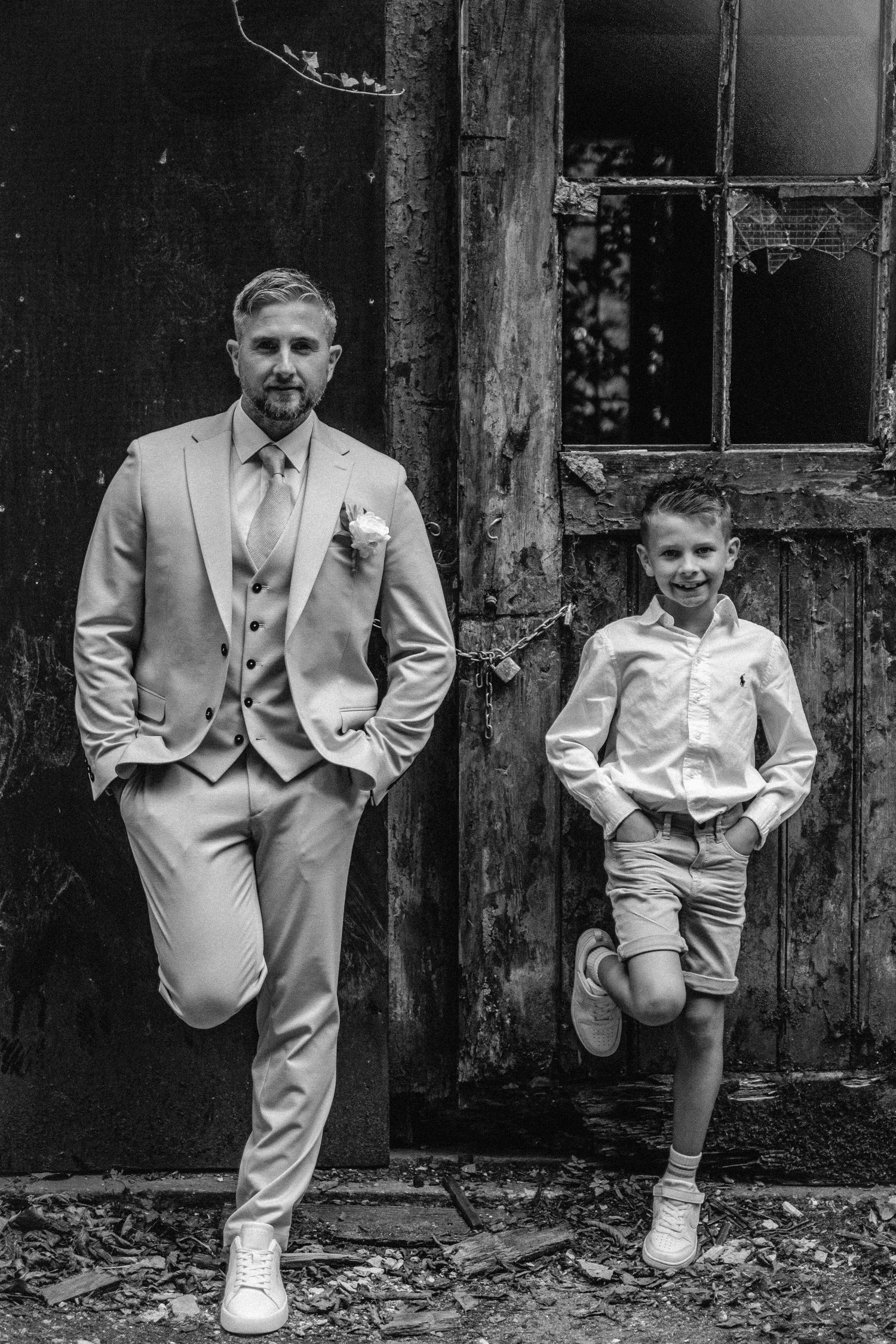 Black and white portrait series showing family in formal attire against rustic backdrop.