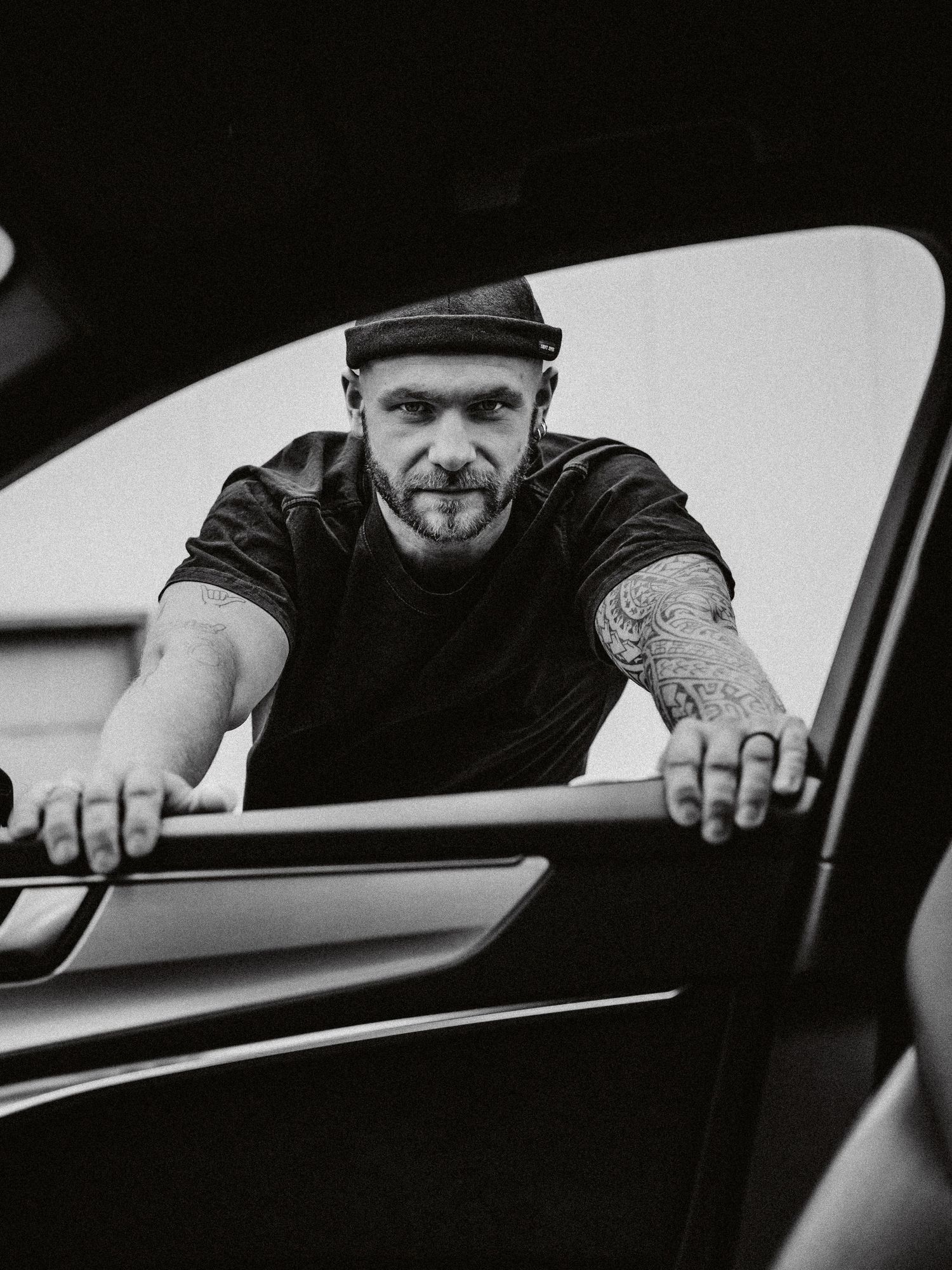 A dramatic black and white photo sequence shows someone reaching through a car window in what appears to be a break-in attempt.