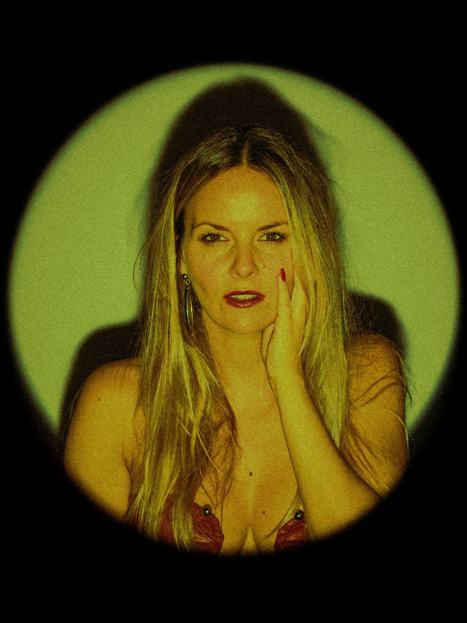 Artistic photo series showing a figure in yellow lighting making expressive hand gestures and poses.