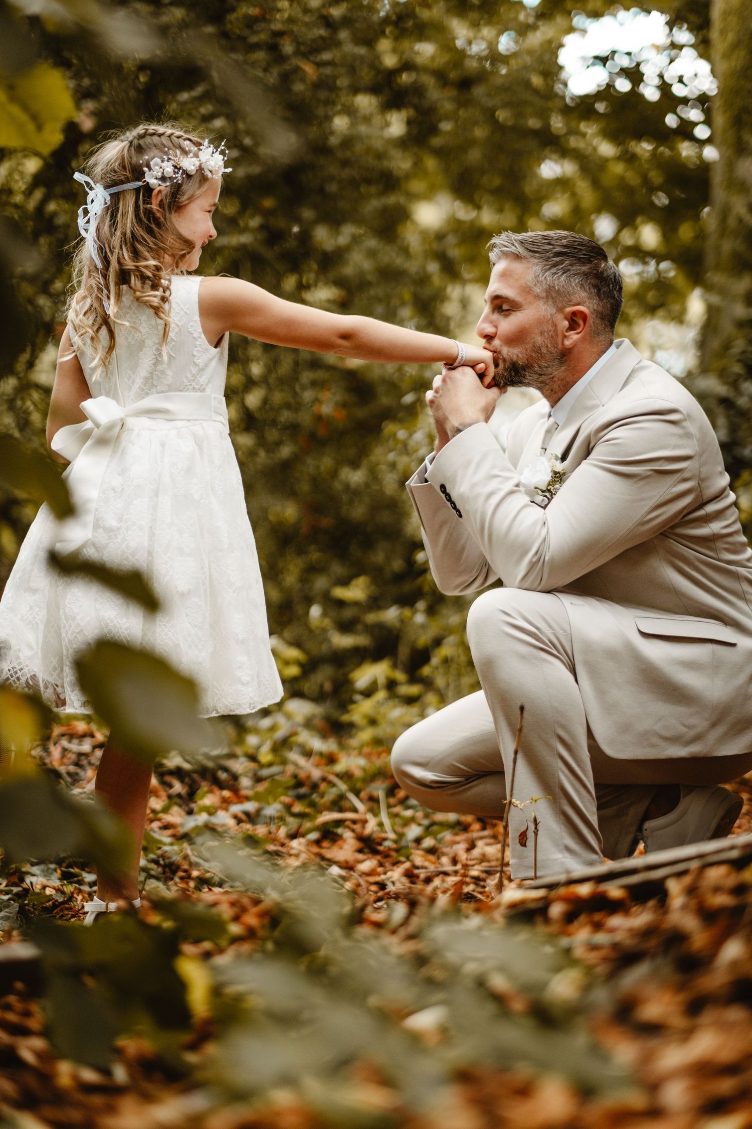 A romantic autumn wedding photoshoot sequence among fallen leaves.