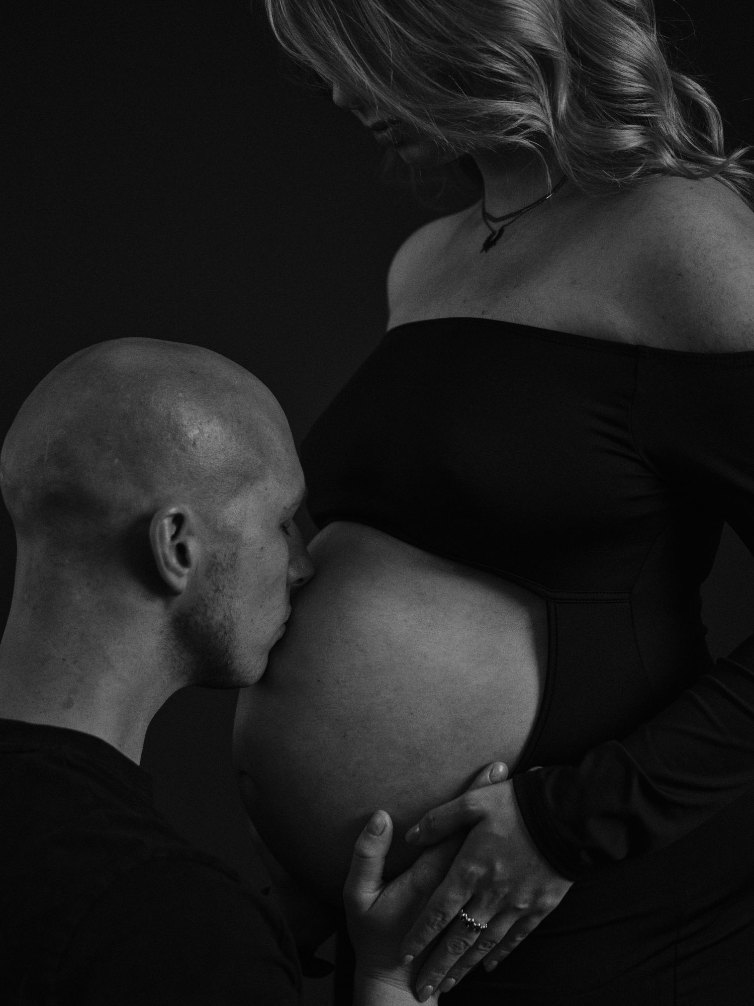 Artistic black and white photo sequence showing intimate close-up moments between two people in dramatic lighting.