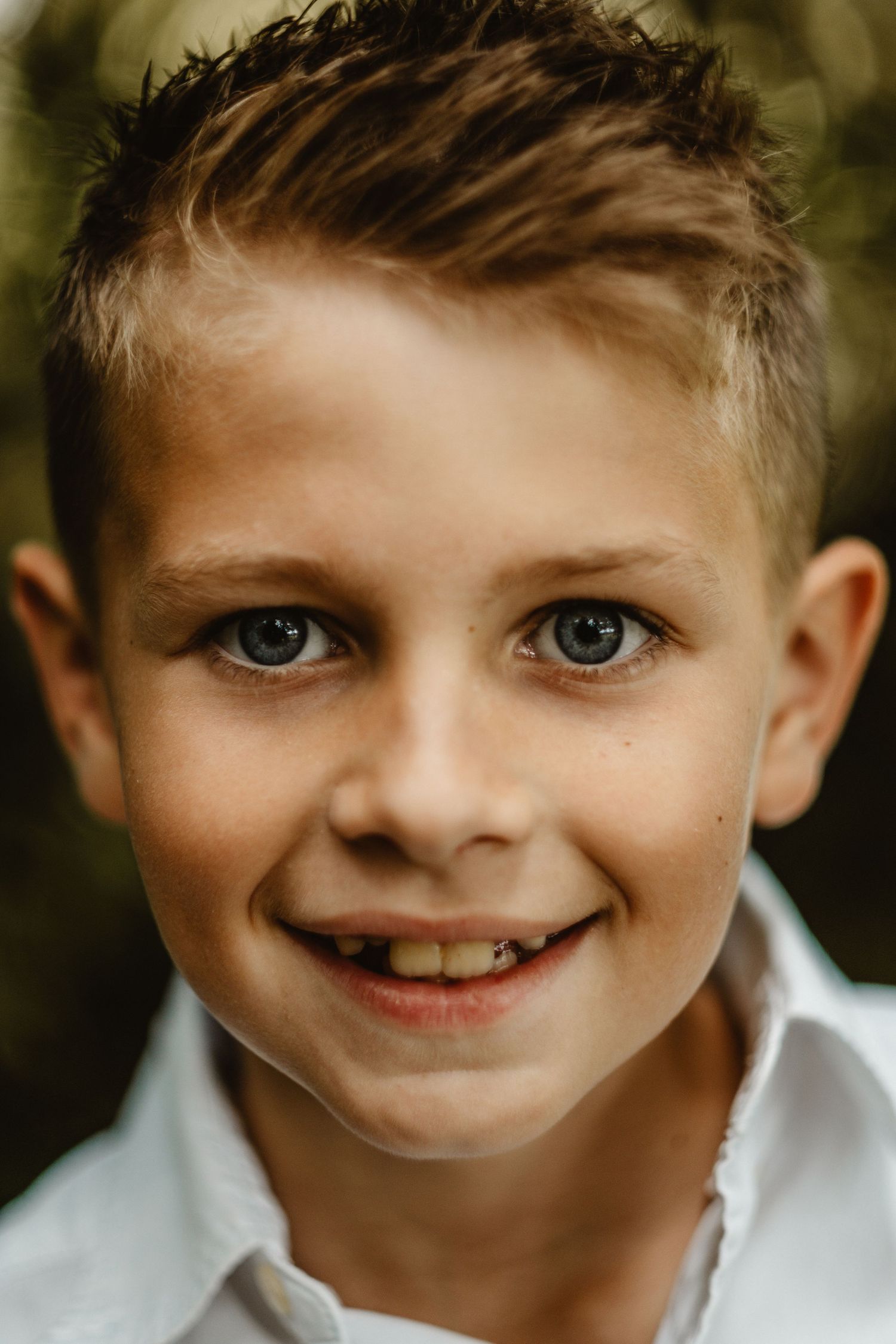 Close-up portrait series showing bright expressions and white shirt.