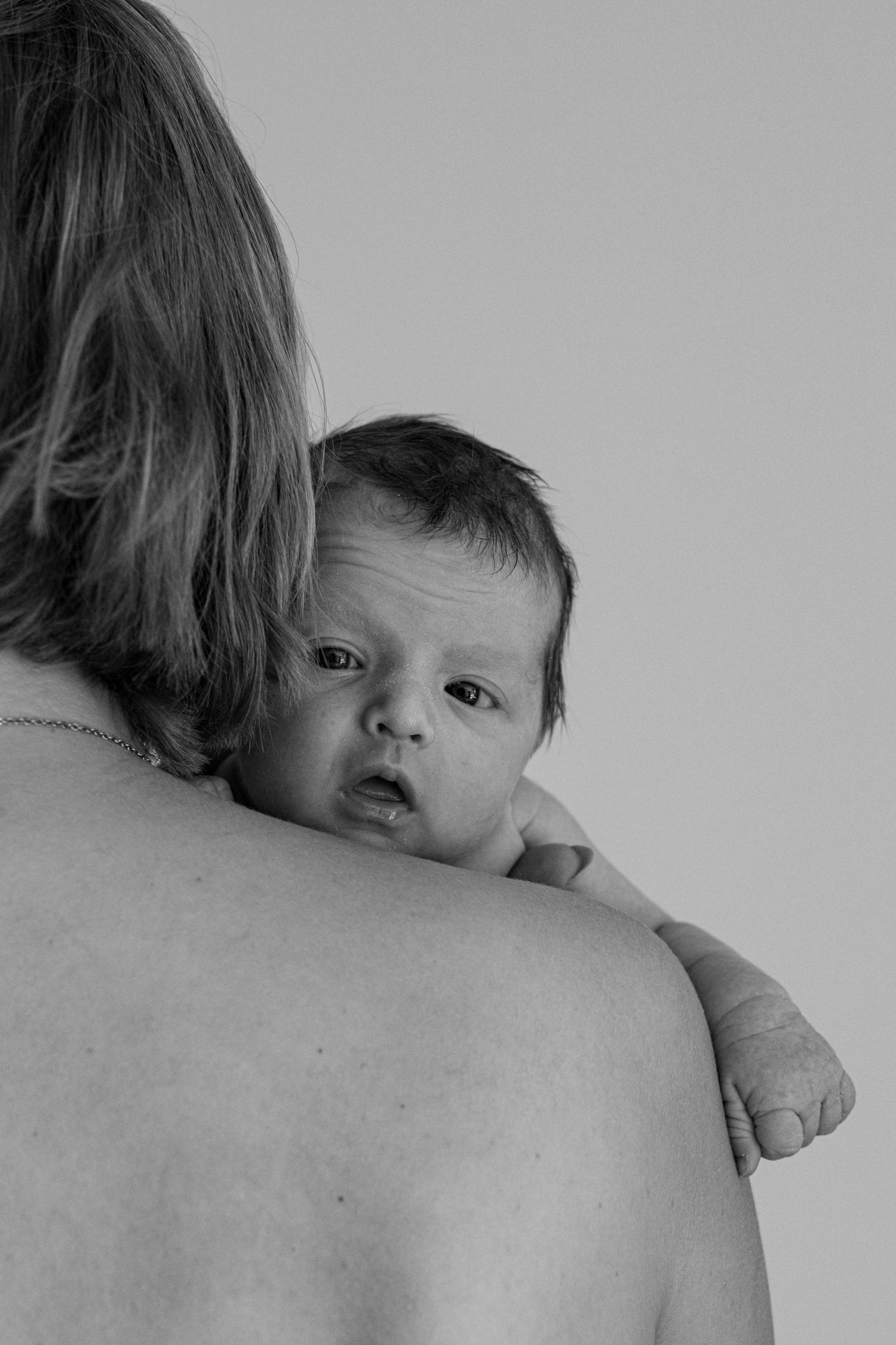 Artistic black and white sequence capturing close moments between parent and child.