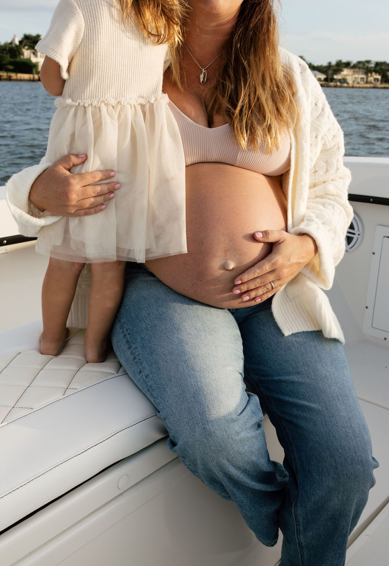 Candid moments captured on a boat deck with waterfront views in the background.