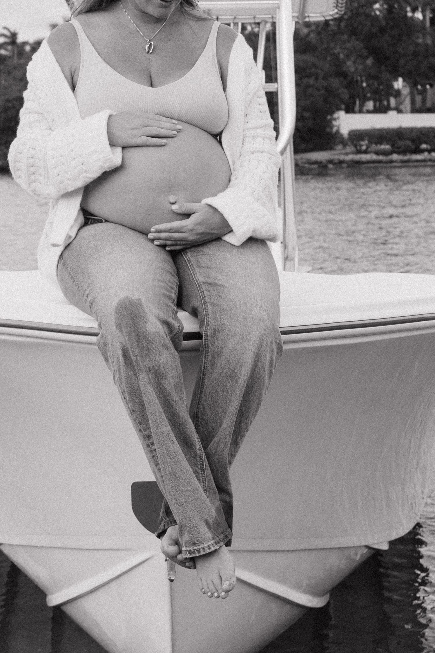 Black and white photographs of quiet moments shared on a boat deck.