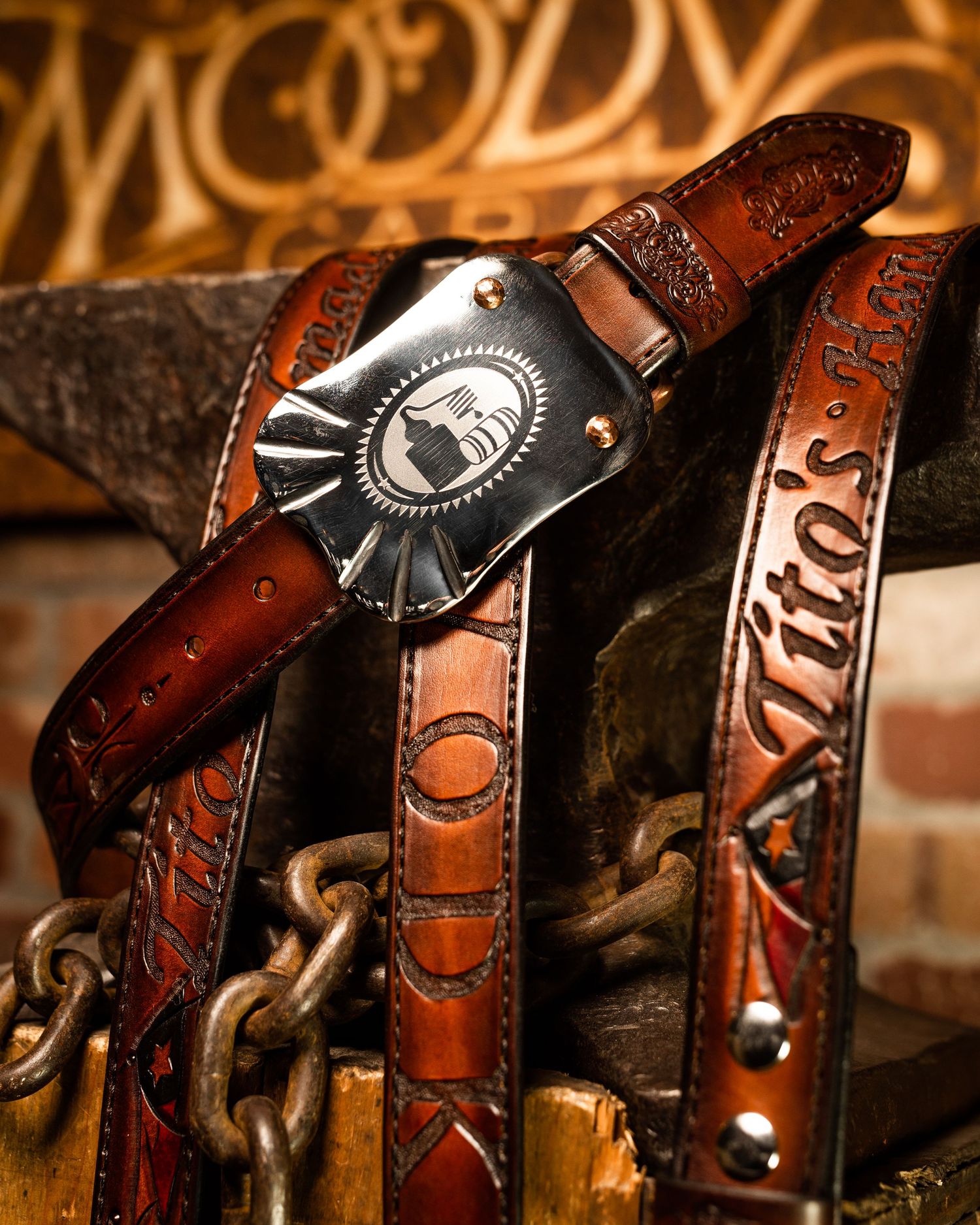 Vintage leather horse saddles lined up displaying ornate details and craftsmanship.