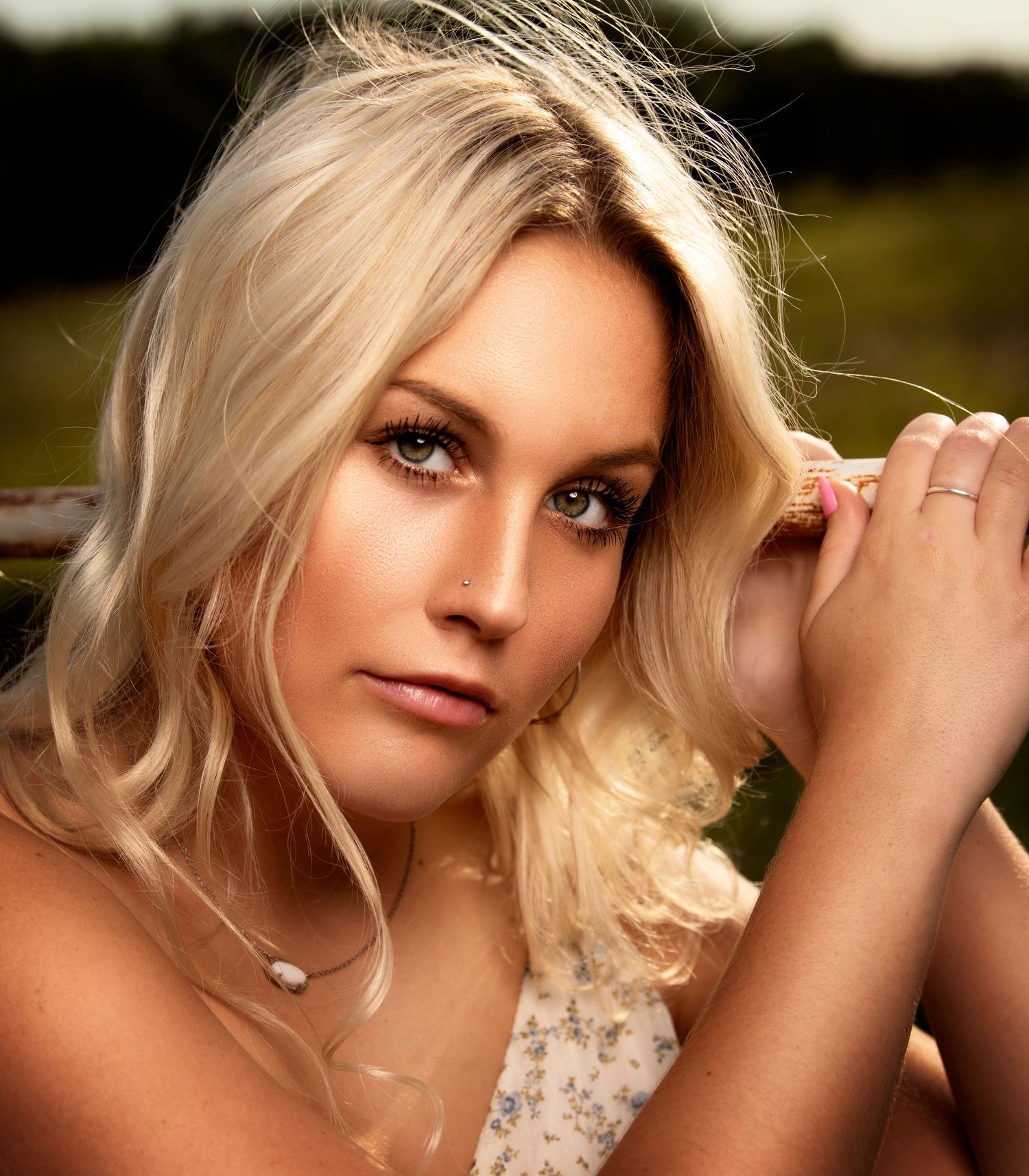 Outdoor portrait series featuring soft natural lighting and gentle expressions.