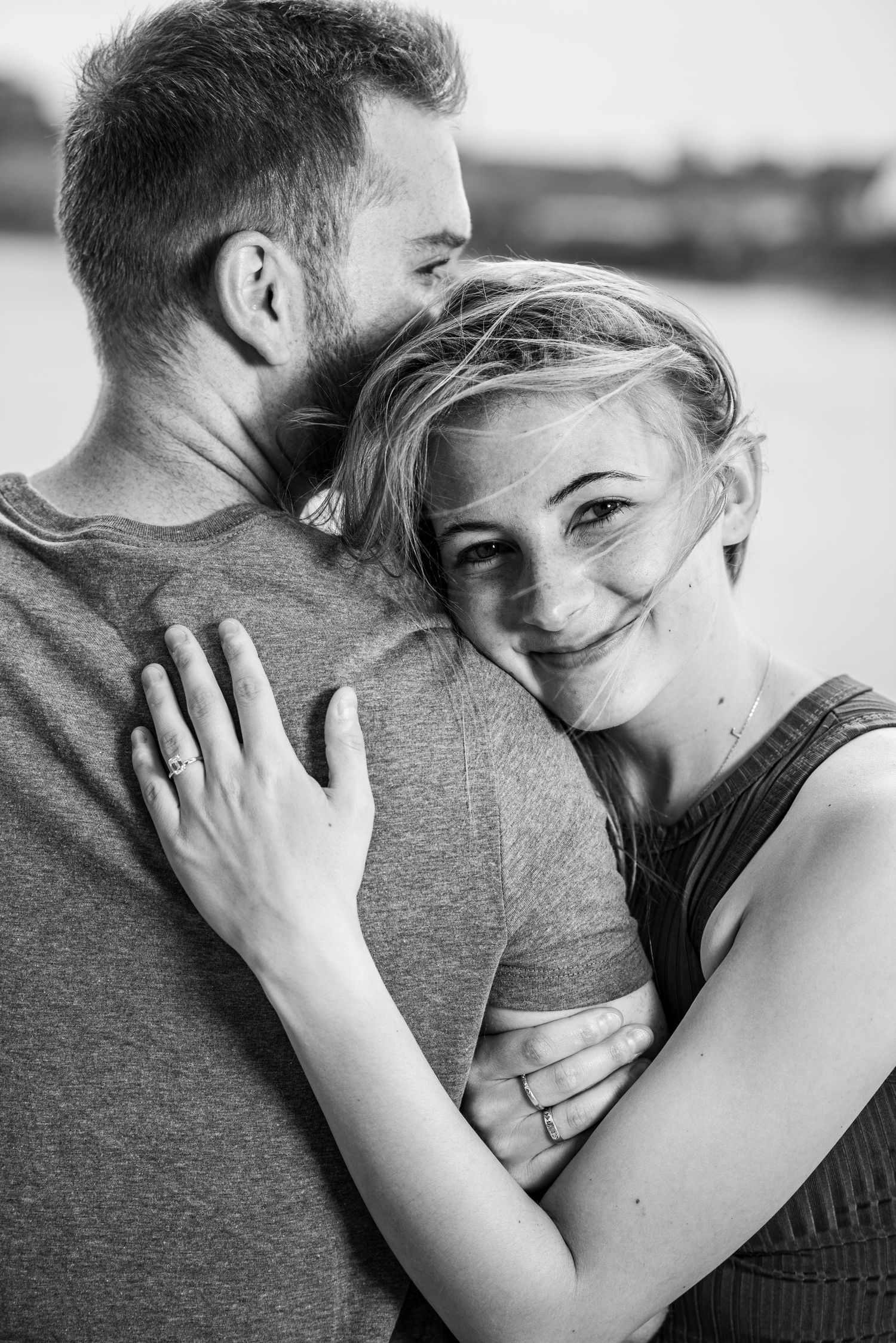 Black and white intimate portrait series showing tender embrace and connection.
