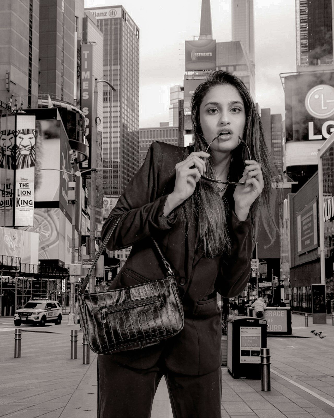 Urban street photography series in Times Square with dramatic black and white tones.