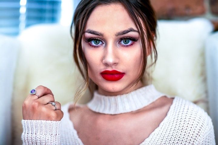 Portrait series in white sweater with bold red lipstick and dramatic makeup.