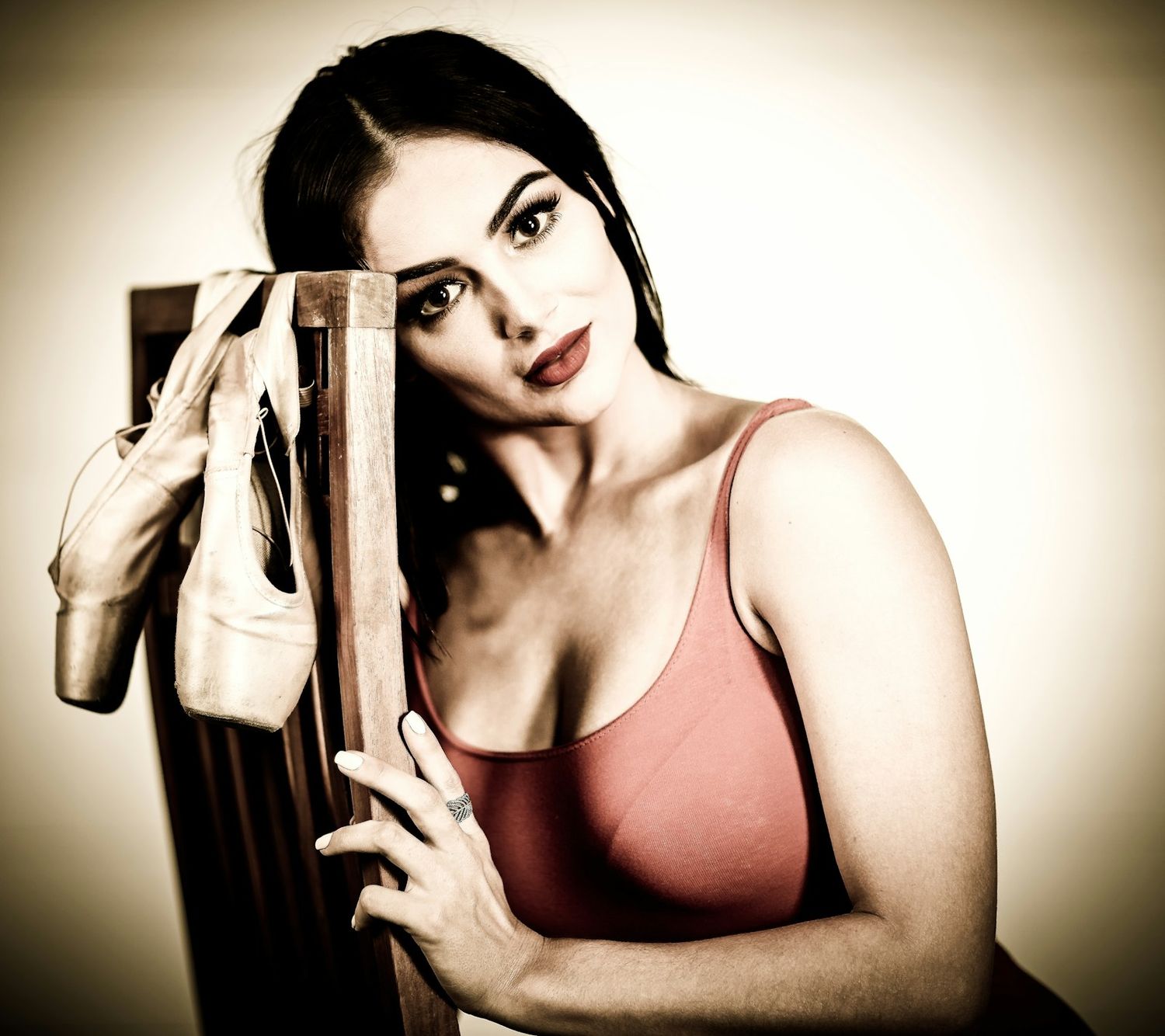 Vintage-toned fitness portraits with dramatic vignette effect.
