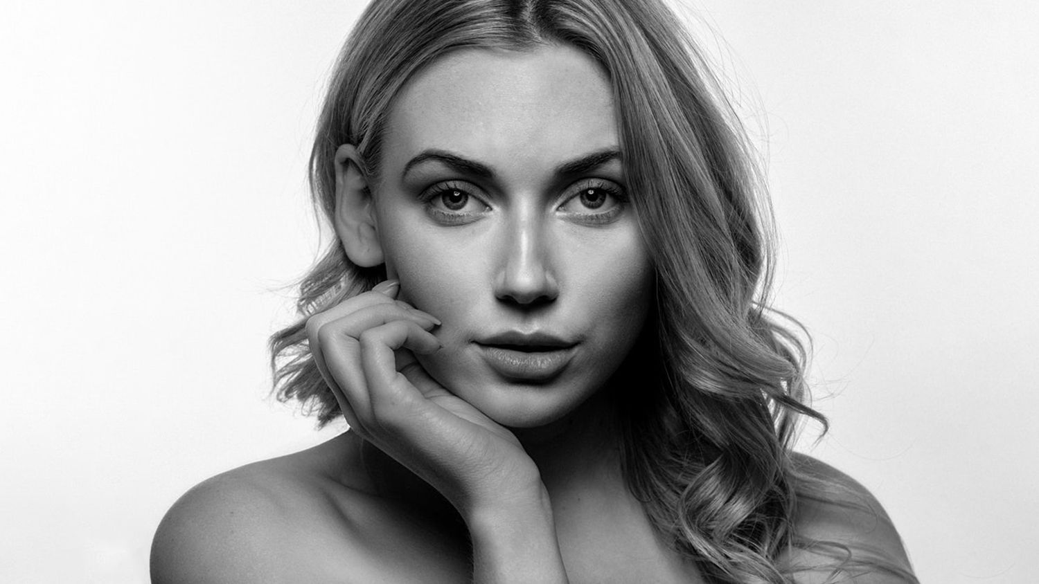 Black and white portrait series with soft lighting and elegant poses.
