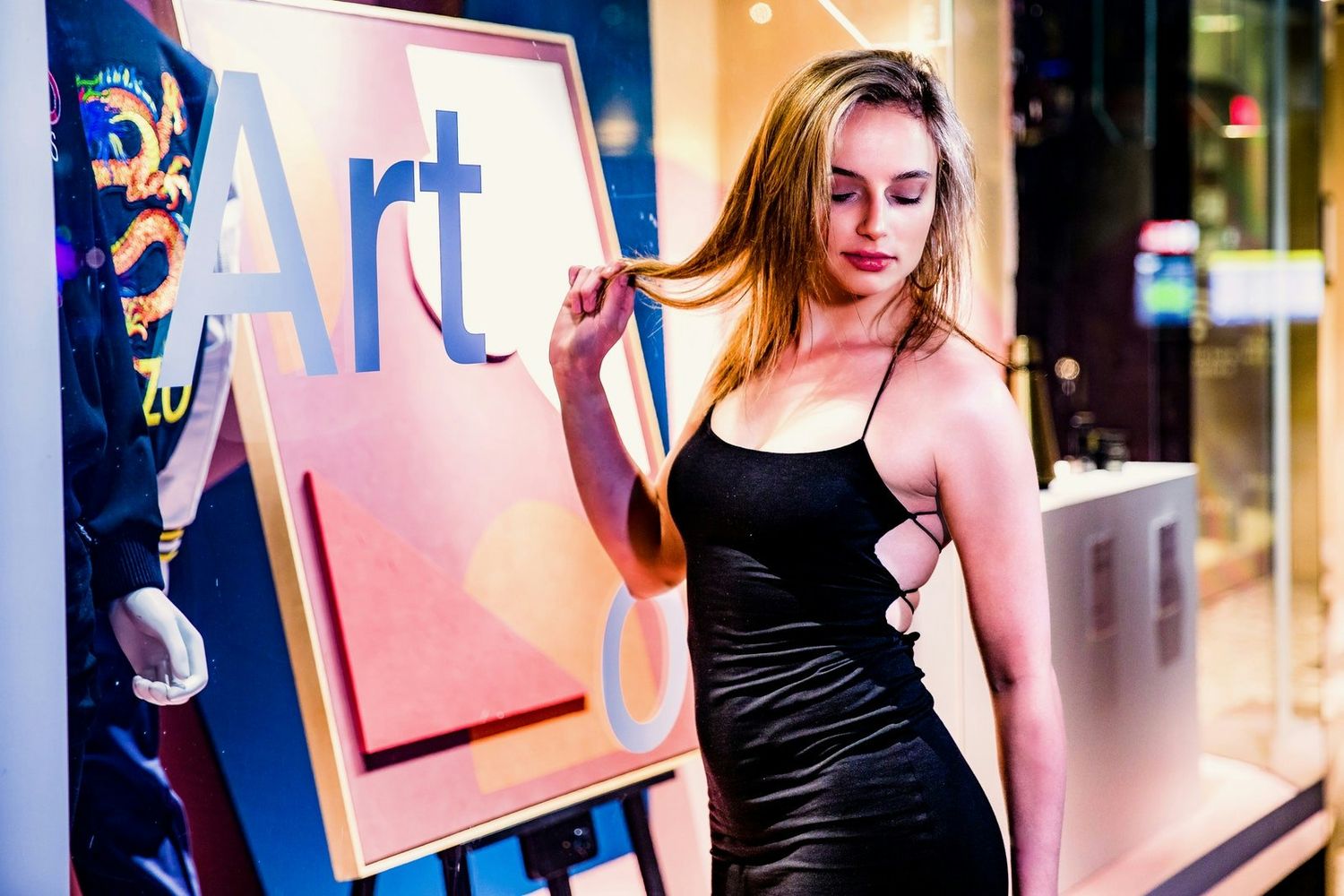 Fashion portraits in urban setting with colorful art gallery backgrounds.