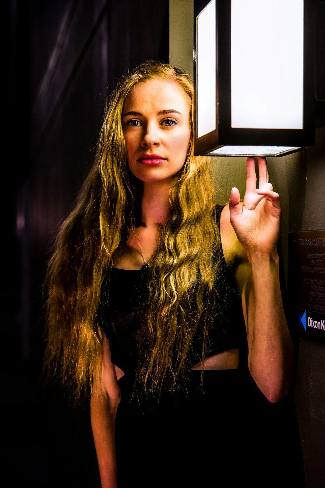Artistic portraits with dramatic lighting and window frame composition.