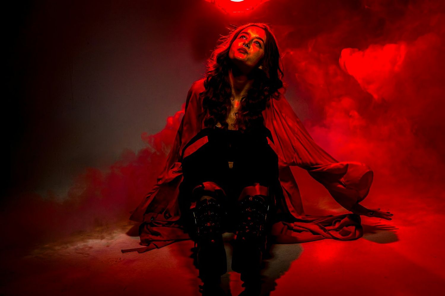 Artistic photo series with dramatic red lighting creating an ethereal atmosphere.