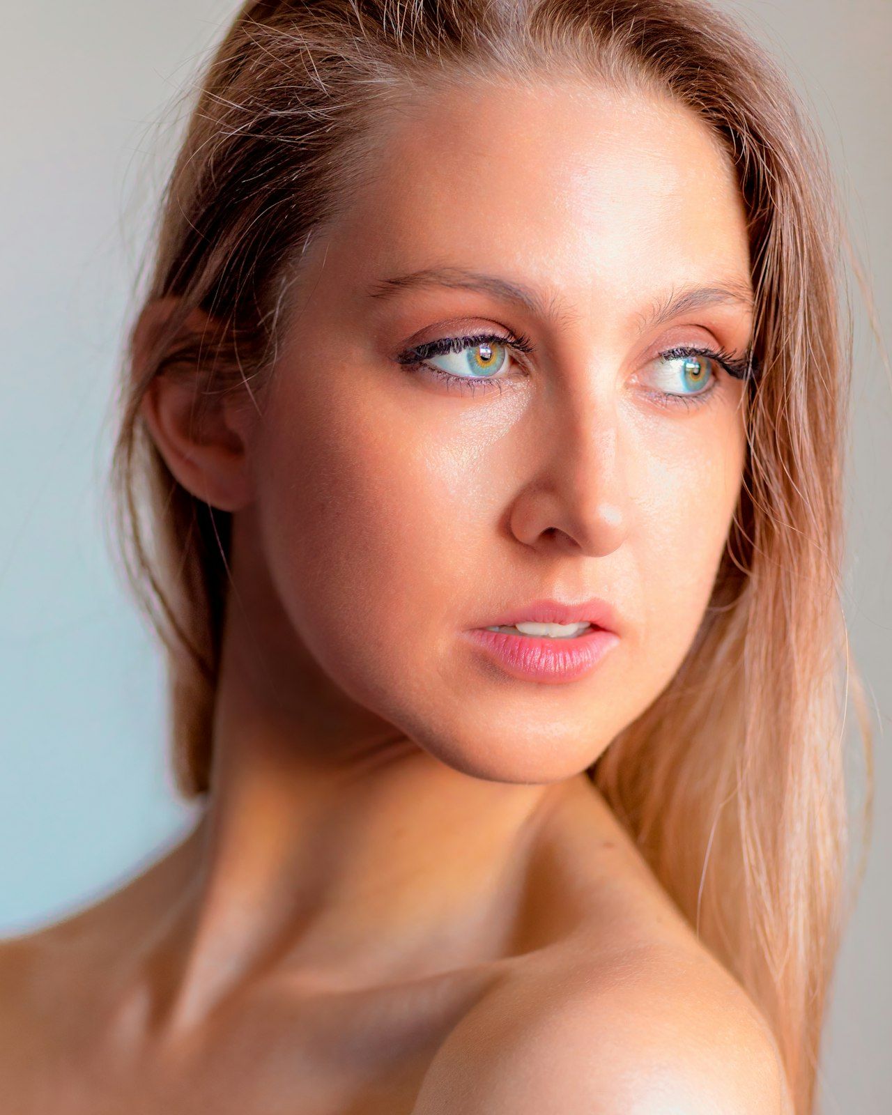 Soft beauty portraits with natural lighting and delicate makeup.