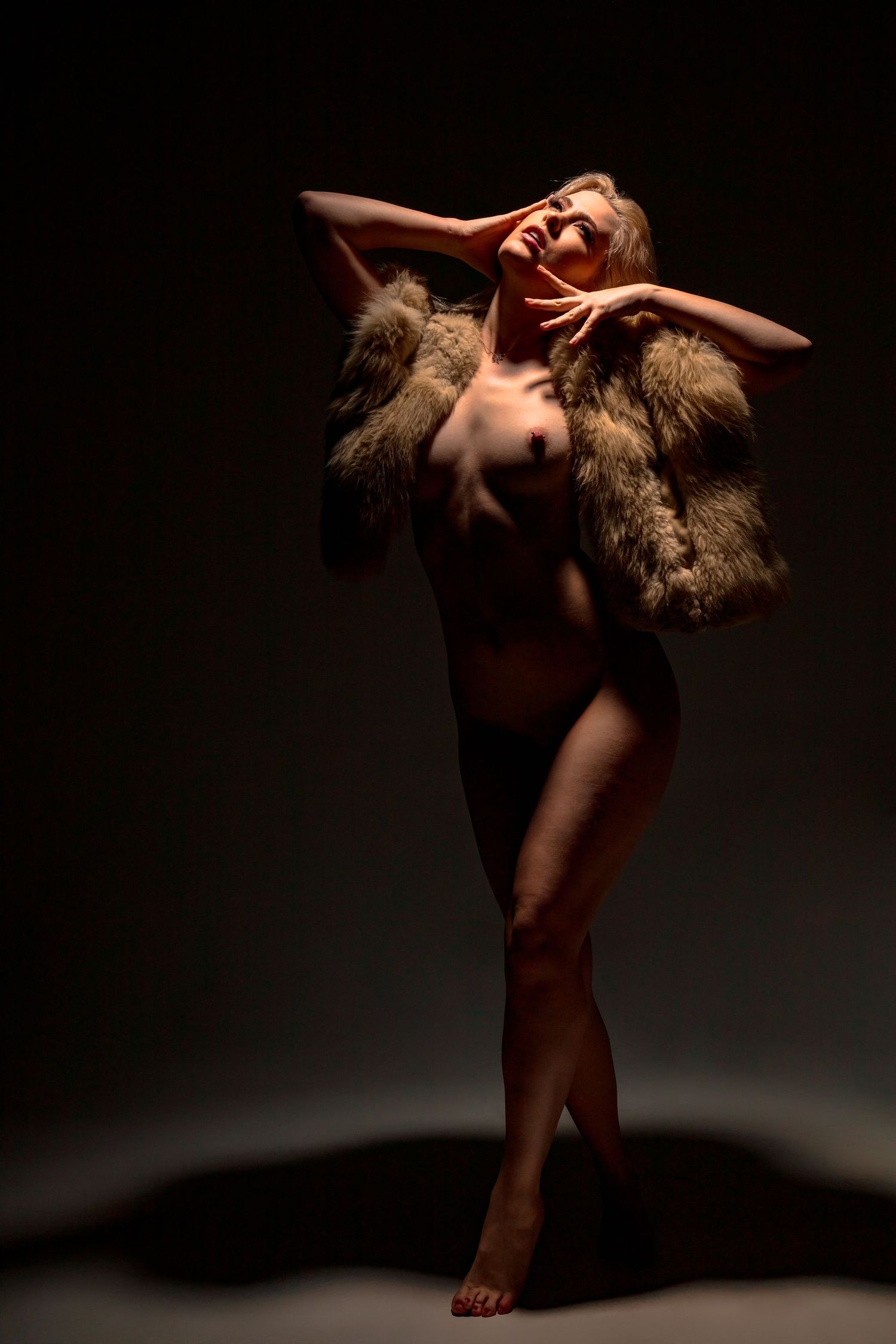 Artistic dance photo series showing graceful movements against dark background in dramatic lighting.