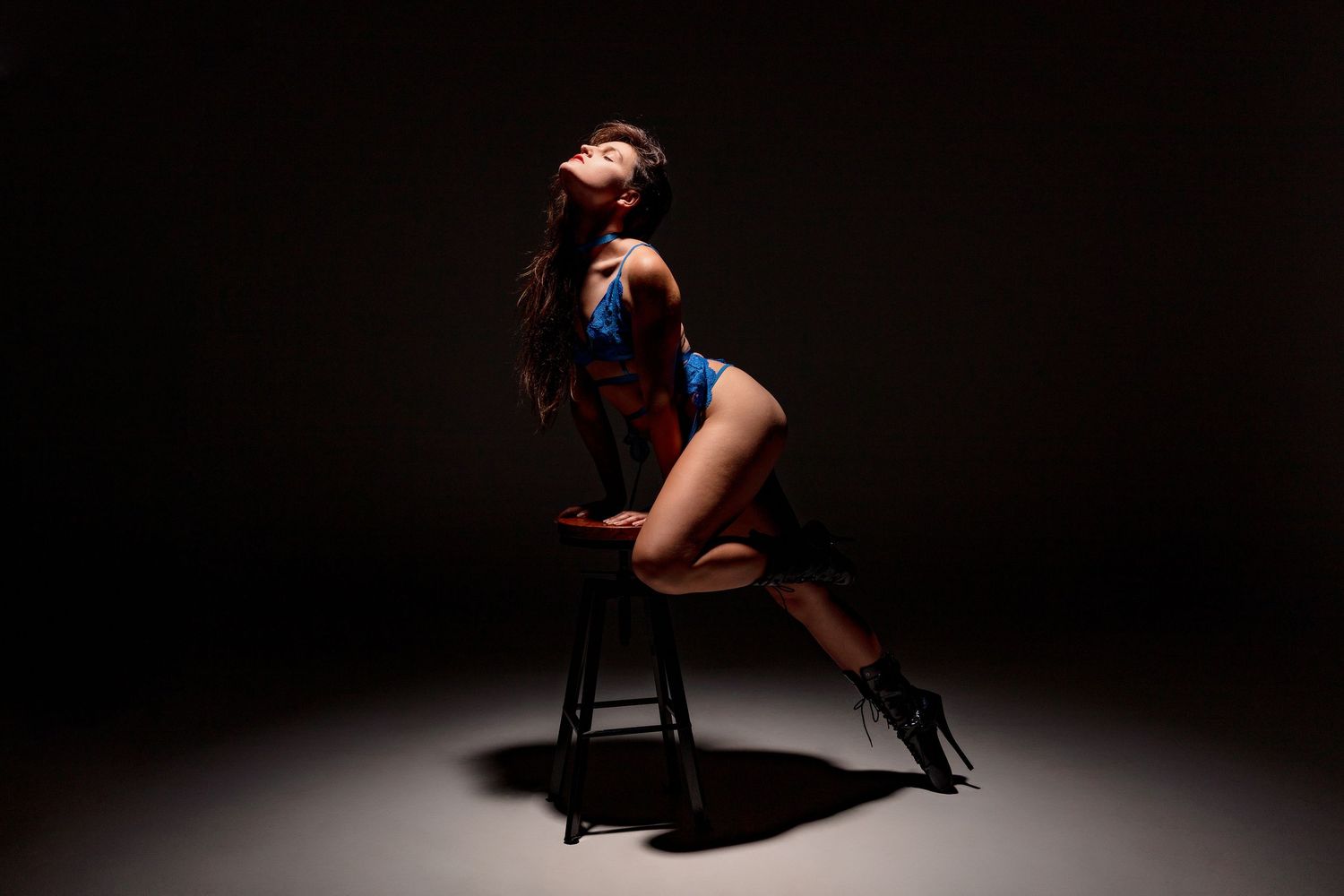 A dramatic dance performance sequence showing a figure in silhouette against a dark background.