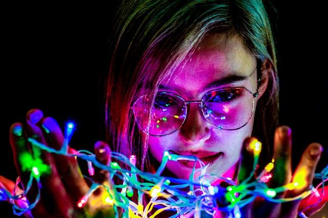 Artistic light painting photography with colorful neon streaks in motion.