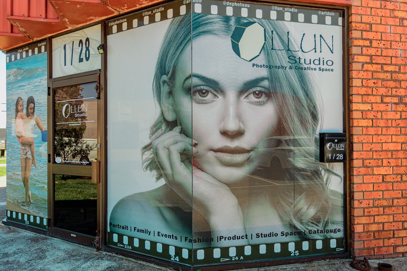 Photo of LLUN Studio frontage with large window displays and brick exterior.