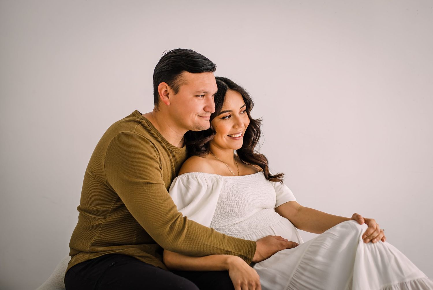 couples mom and dad at studio maternity photos