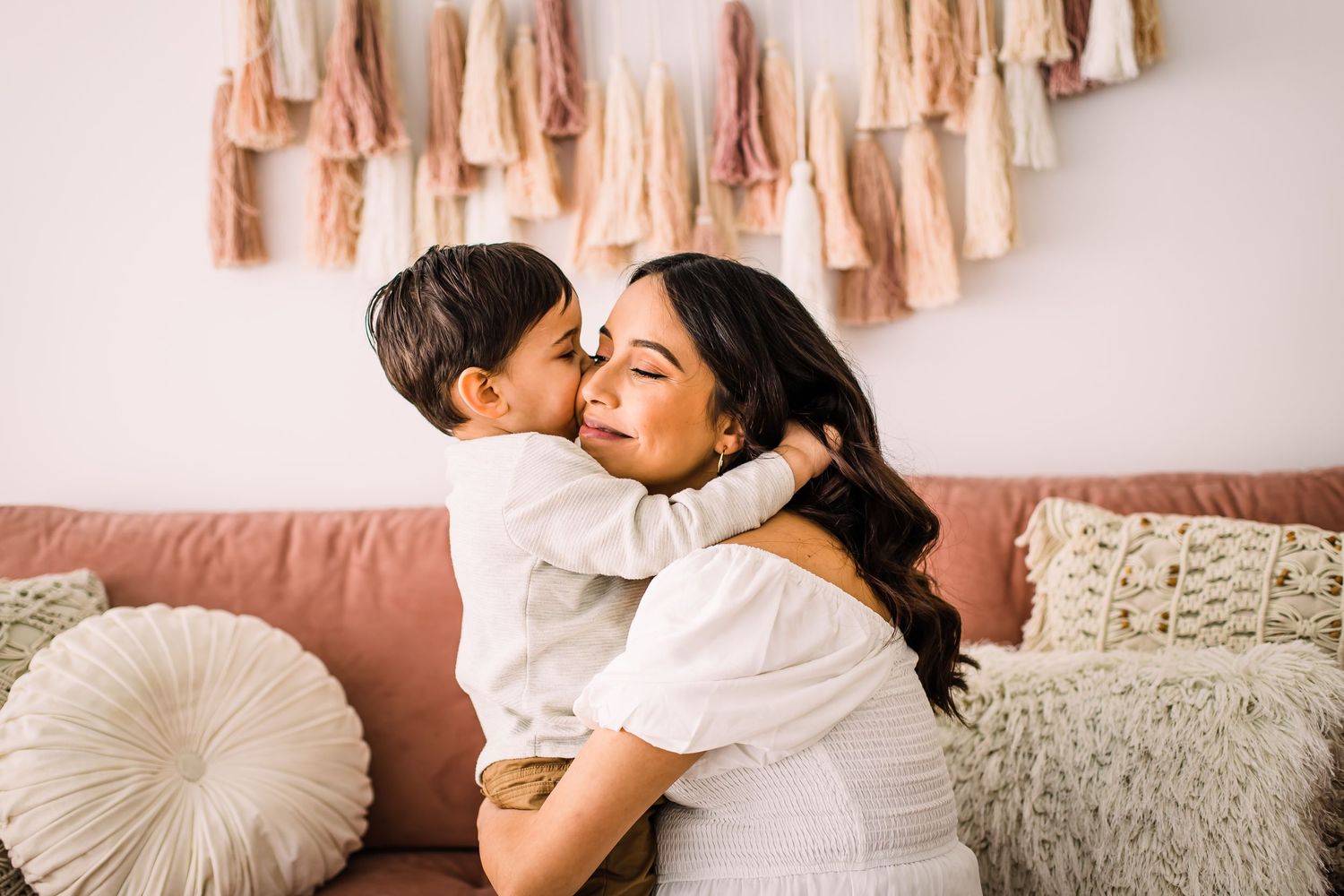 mom and child hugging studio maternity photoshoot